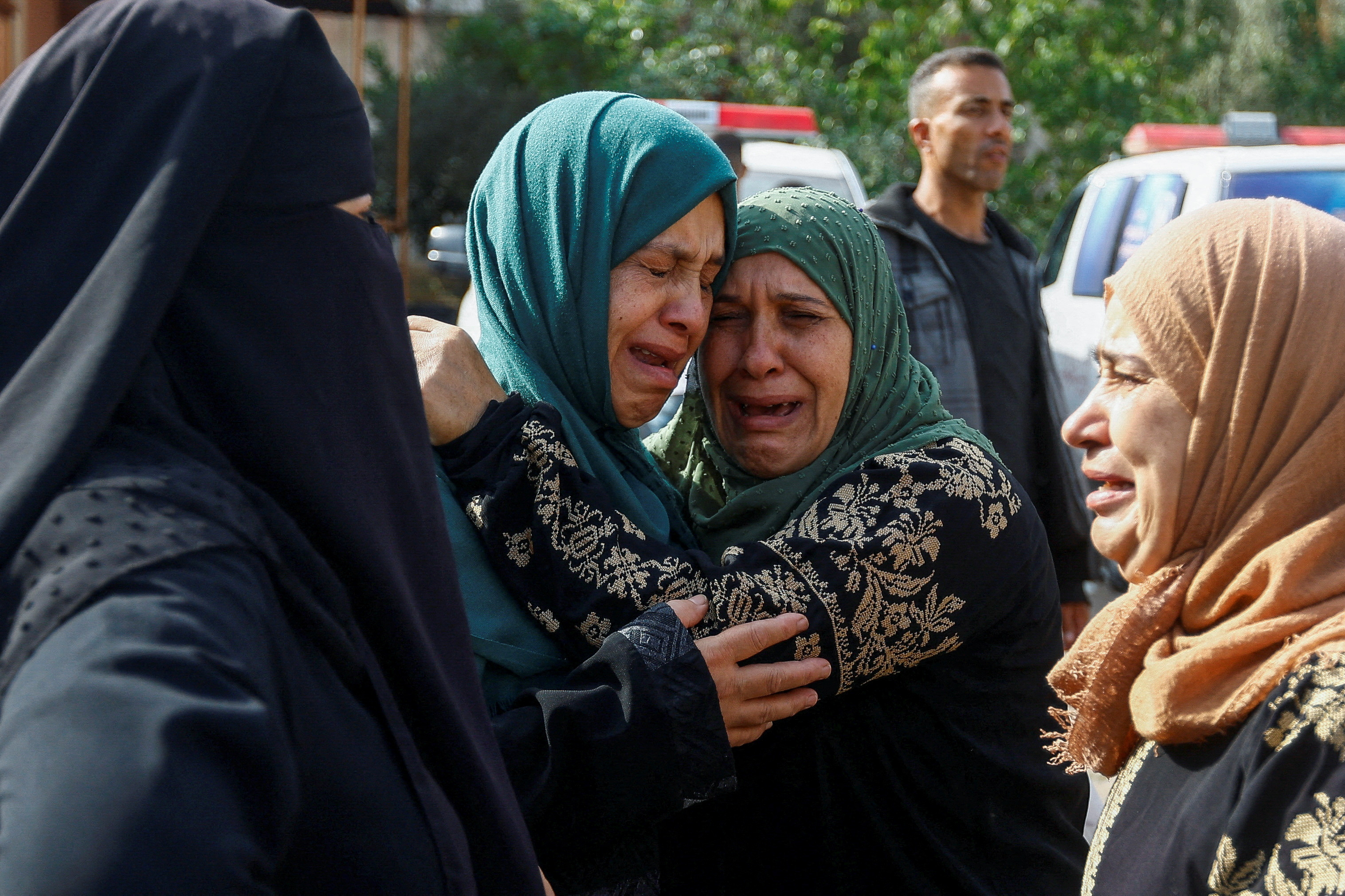 Mourners attend the funeral of Palestinians from the al-Astal family, who were killed in Israeli strikes, in Khan Younis