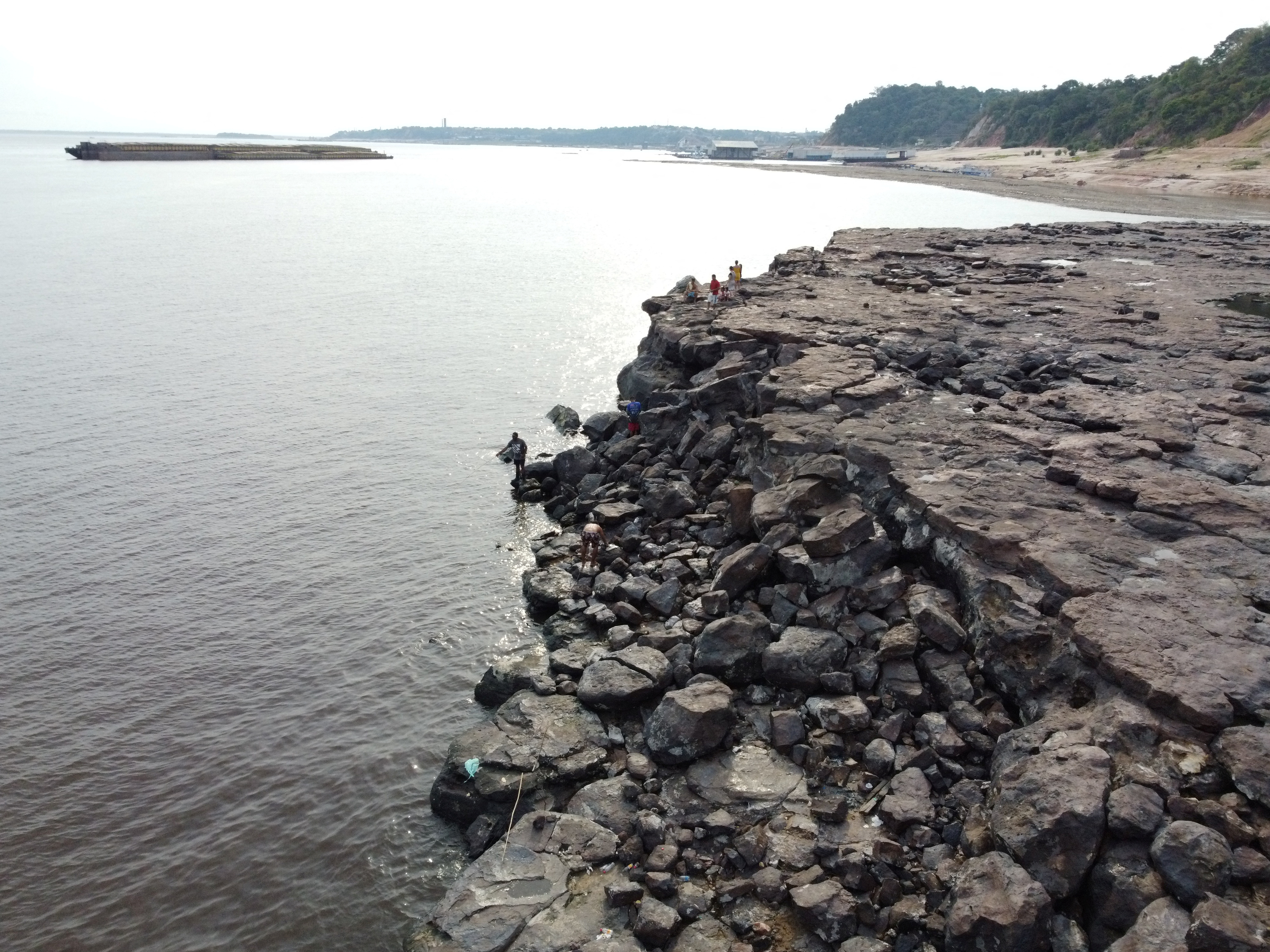 A view of ancient stone carvings on a rocky point of the Amazon river
