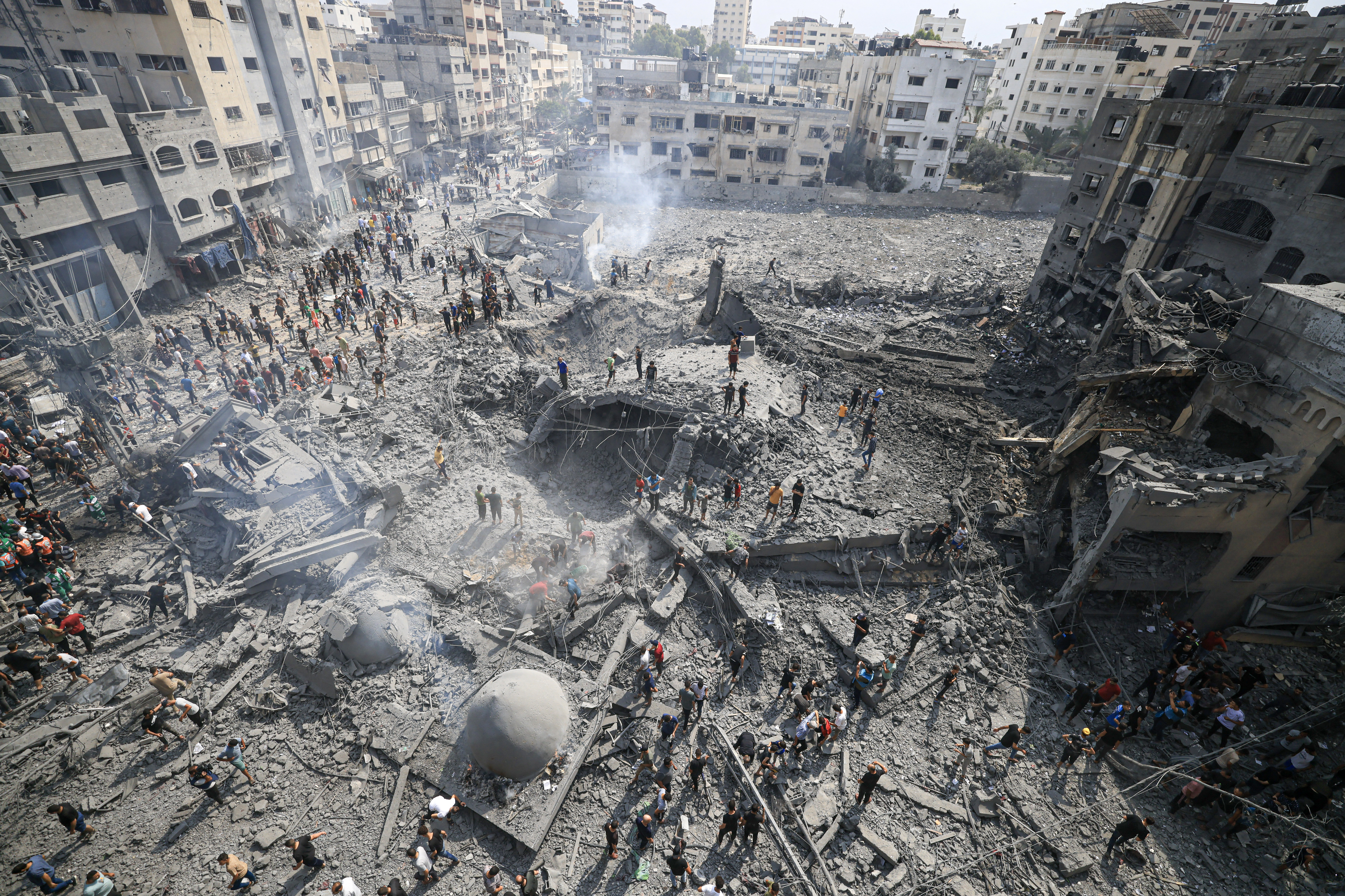 Palestinians inspect the damage