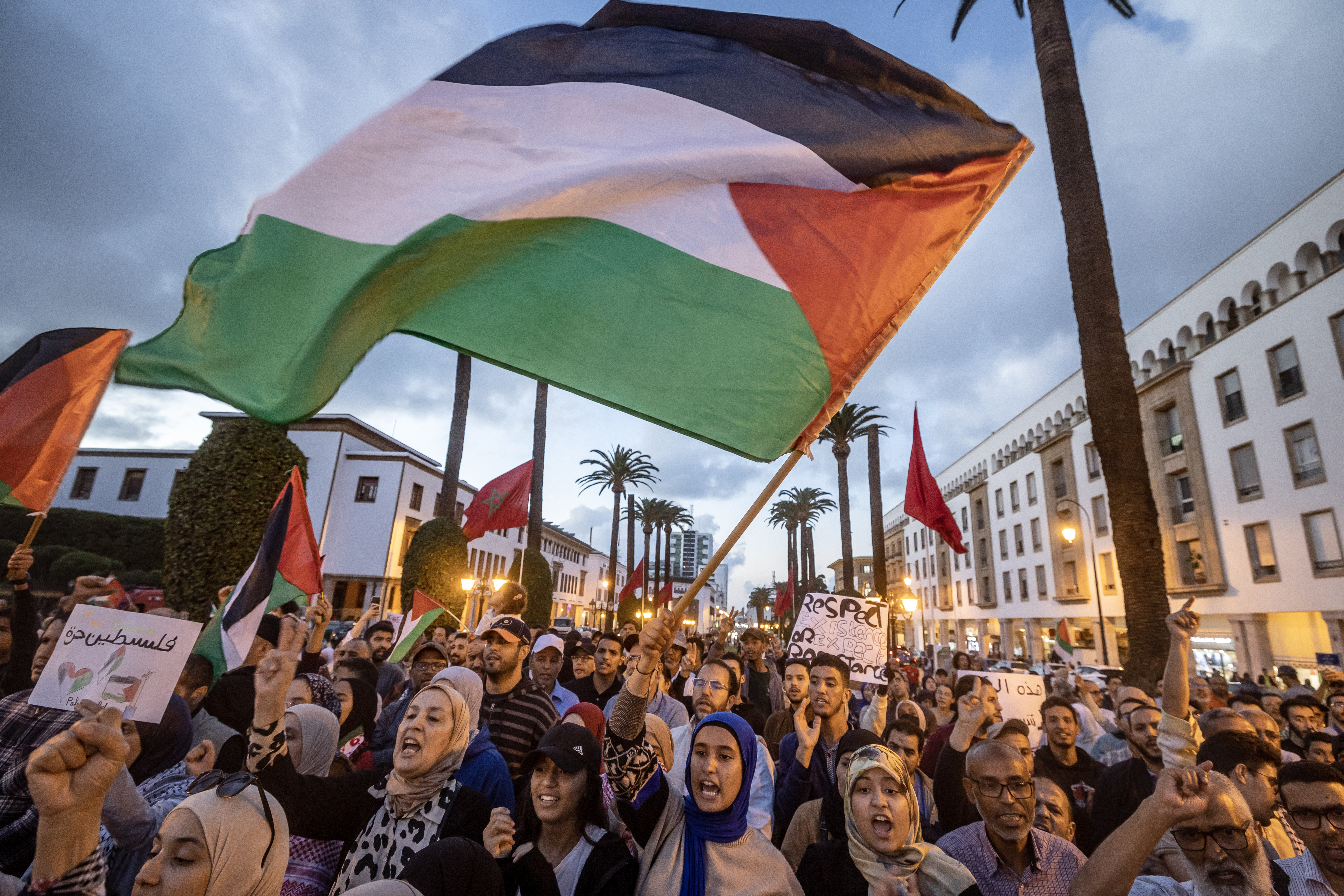 Moroccans wave the Palestinian flag during a gathering in Rabat on October 20, 2023 in support of Palestinians in the Gaza Strip amid the ongoing battles between Israel and the Palestinian group Hamas. (Photo by FADEL SENNA / AFP)