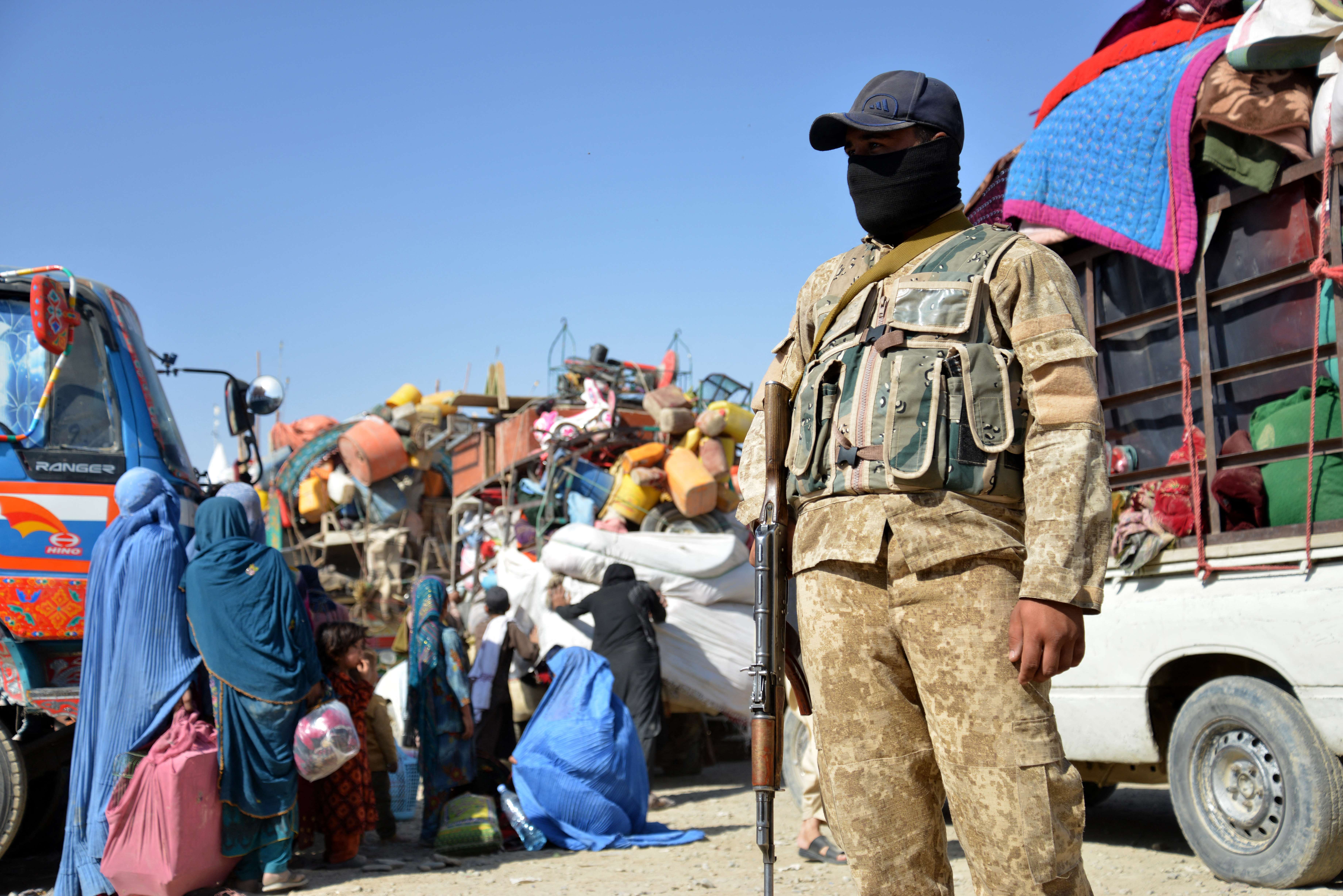 Afghan refugees arrive in trucks from Pakistan at the Afghanistan-Pakistan Torkham border in Nangarhar province