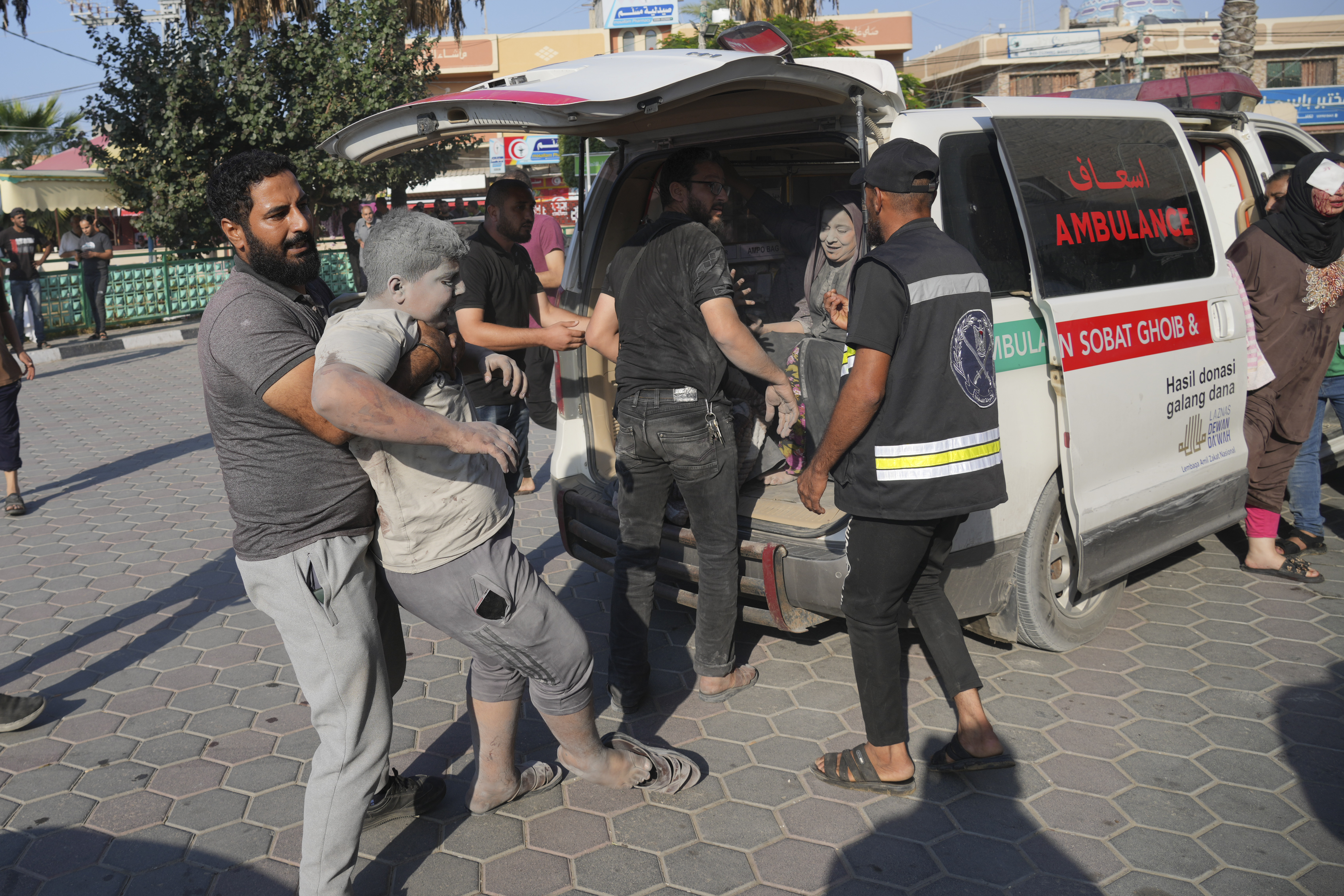 Palestinians wounded in Israeli air strikes on Gaza Strip are brought to al-Aqsa hospital in Deir el-Balah City, Gaza Strip