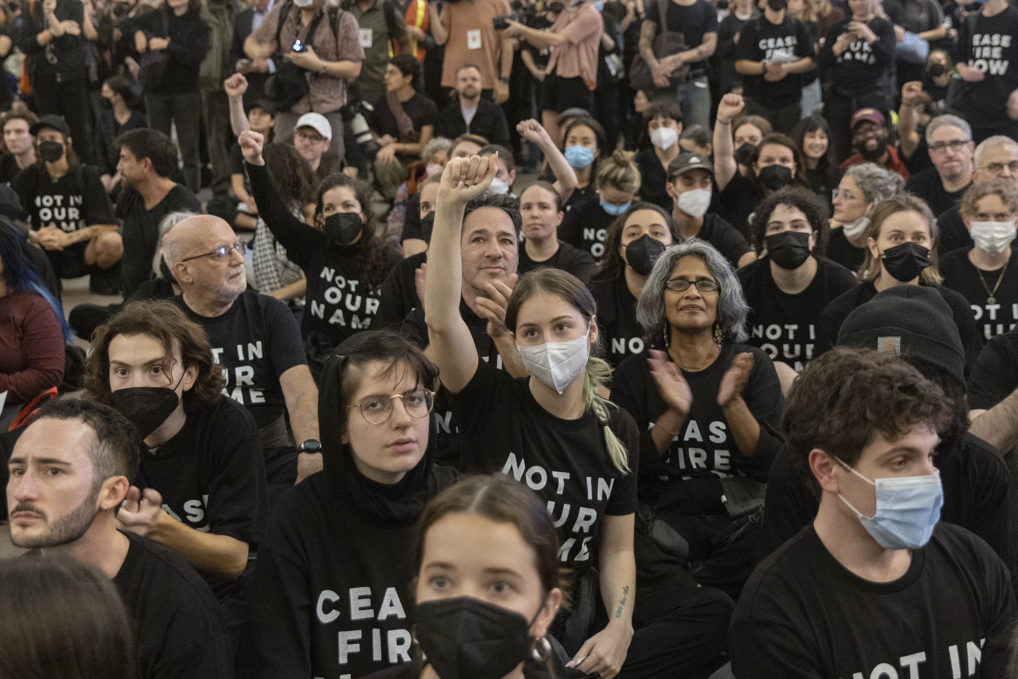 A close up of the protesters wearing black t-shirts