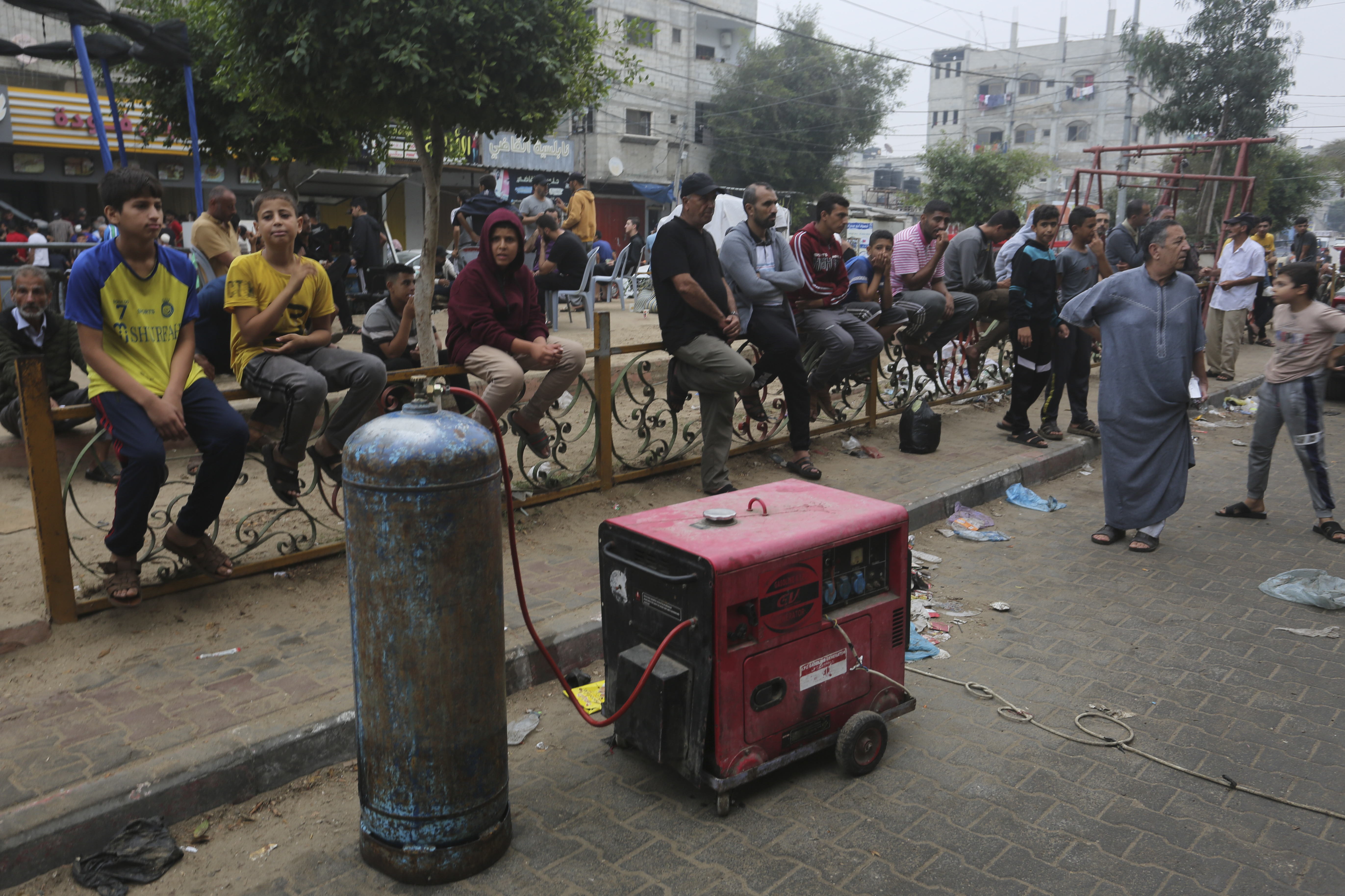 Palestinians wait to buy bread during the ongoing bombardment of the Gaza Strip in Rafah on Sunday