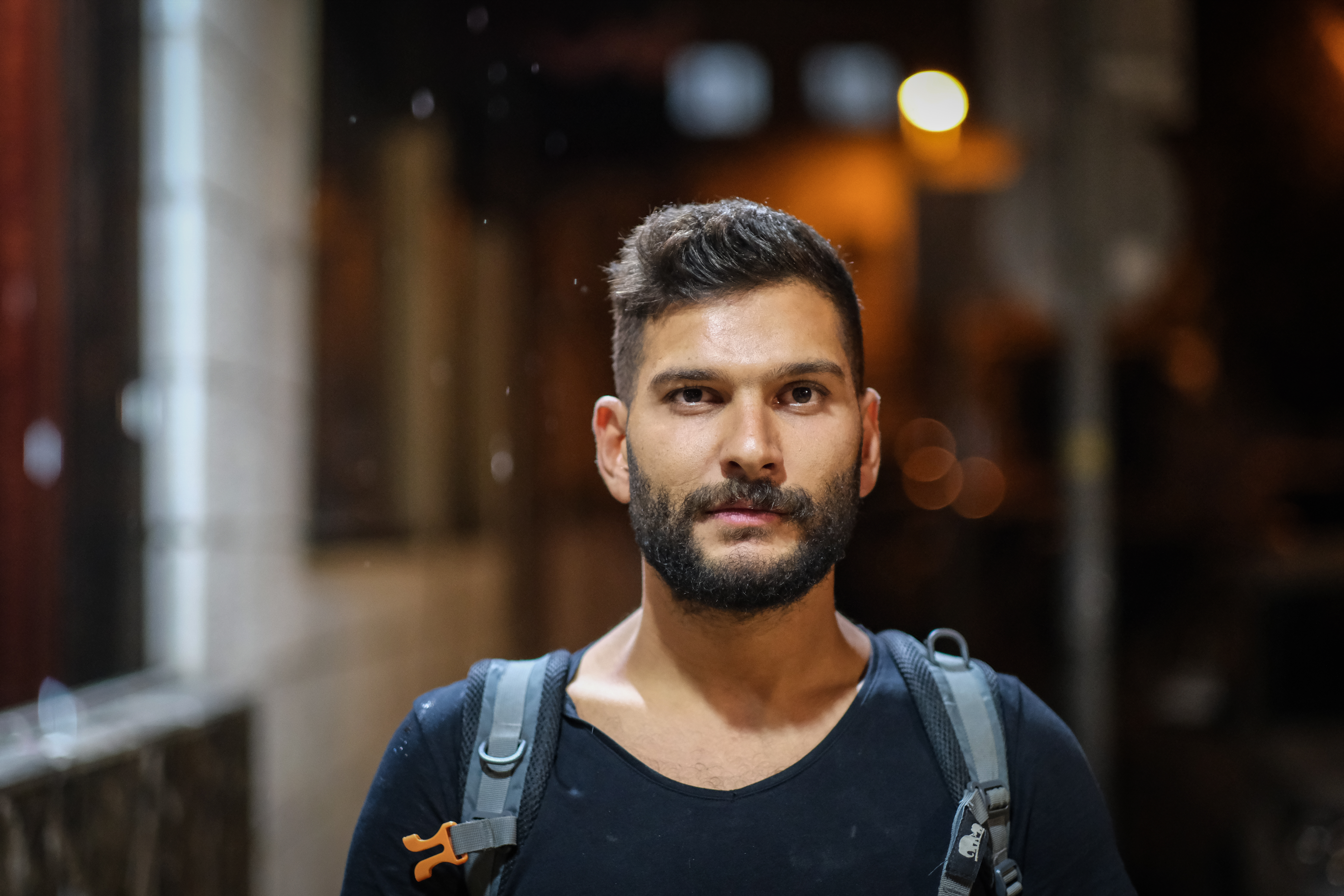 Afghani staring straight at camera with an open expression