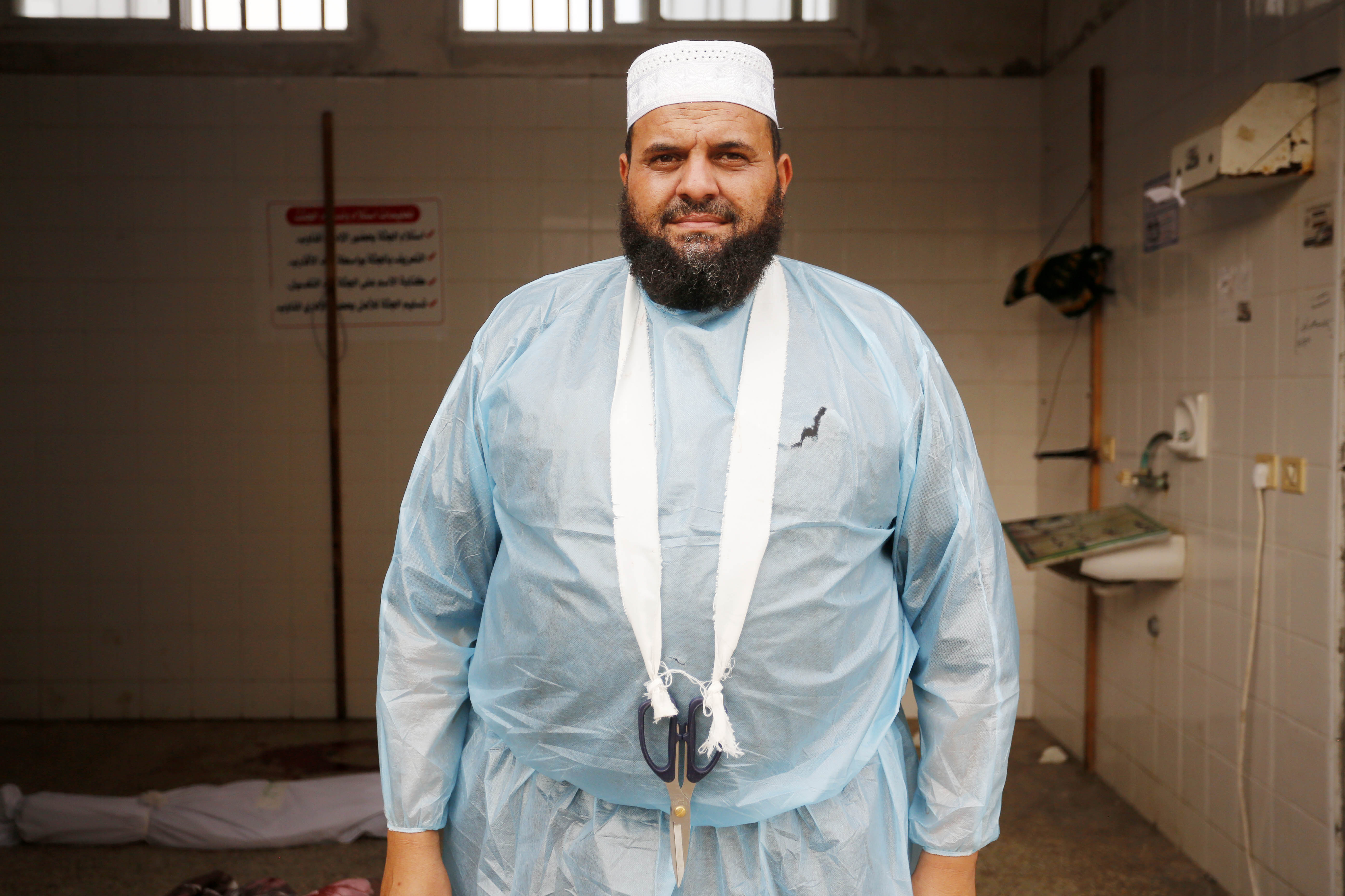 Abu Ammar and he washes the bodies of the dead