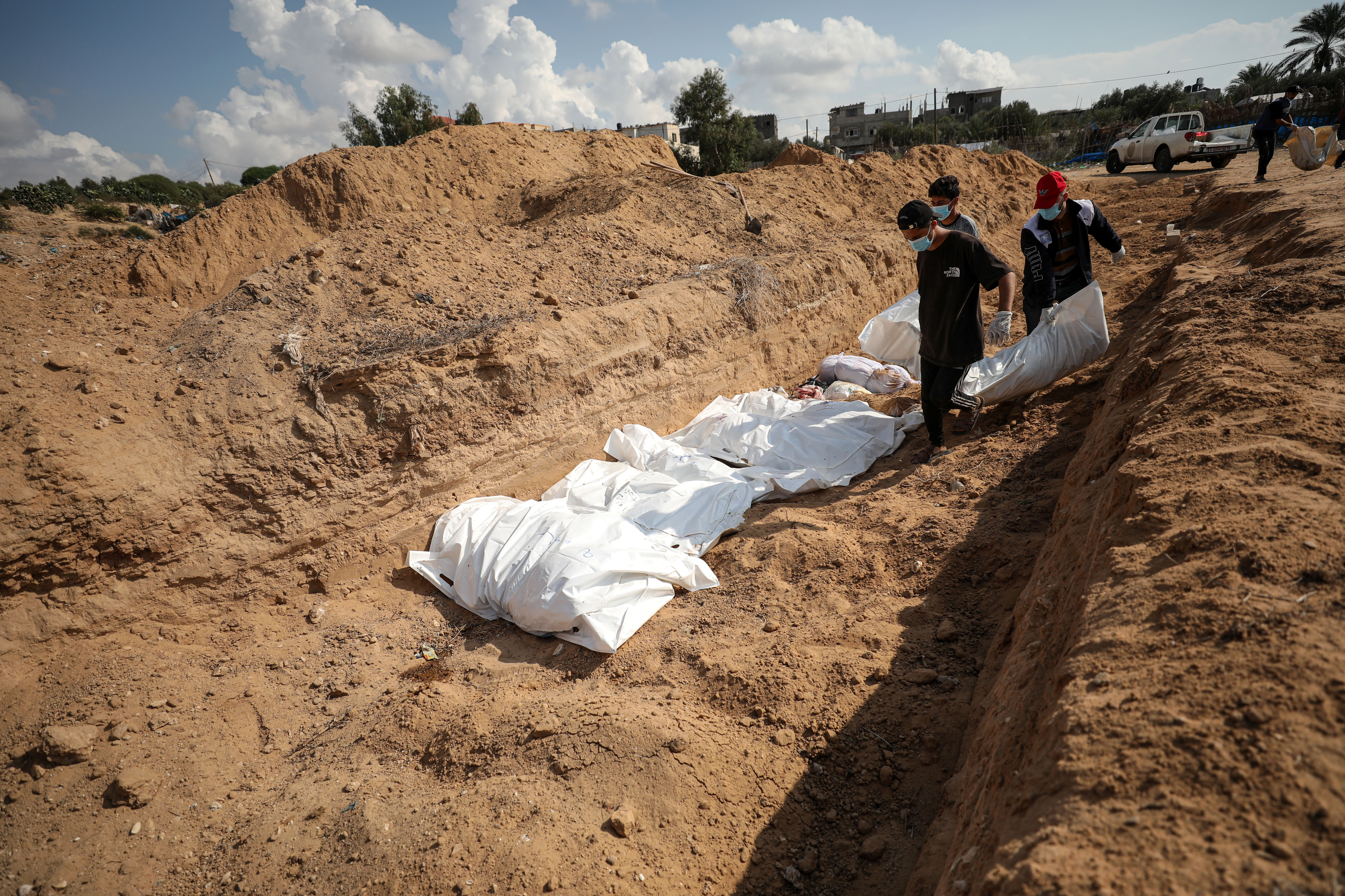 Torn remains, burned beyond recognition: Burying Gaza's unknown bodies