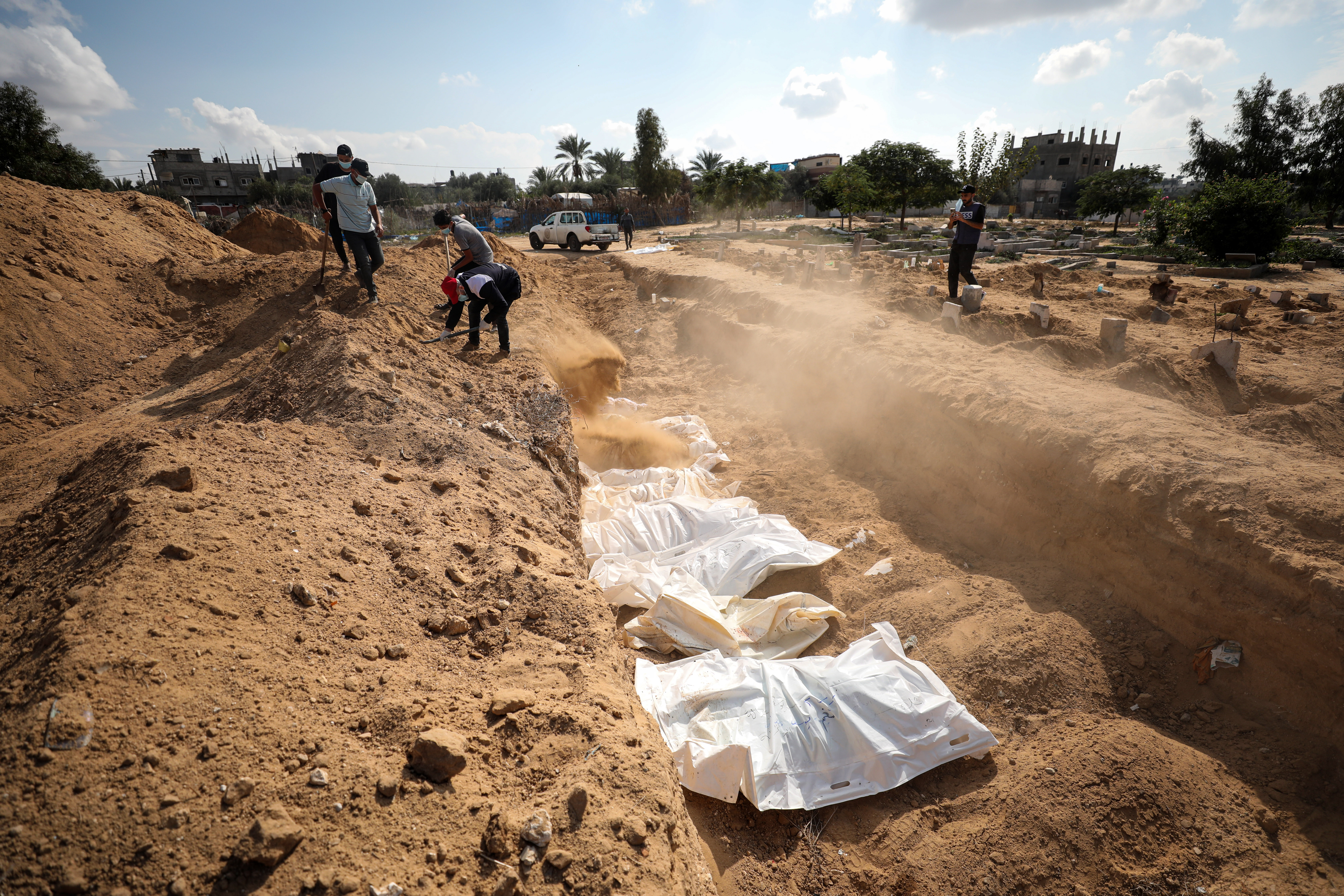 Torn remains, burned beyond recognition: Burying Gaza's unknown bodies