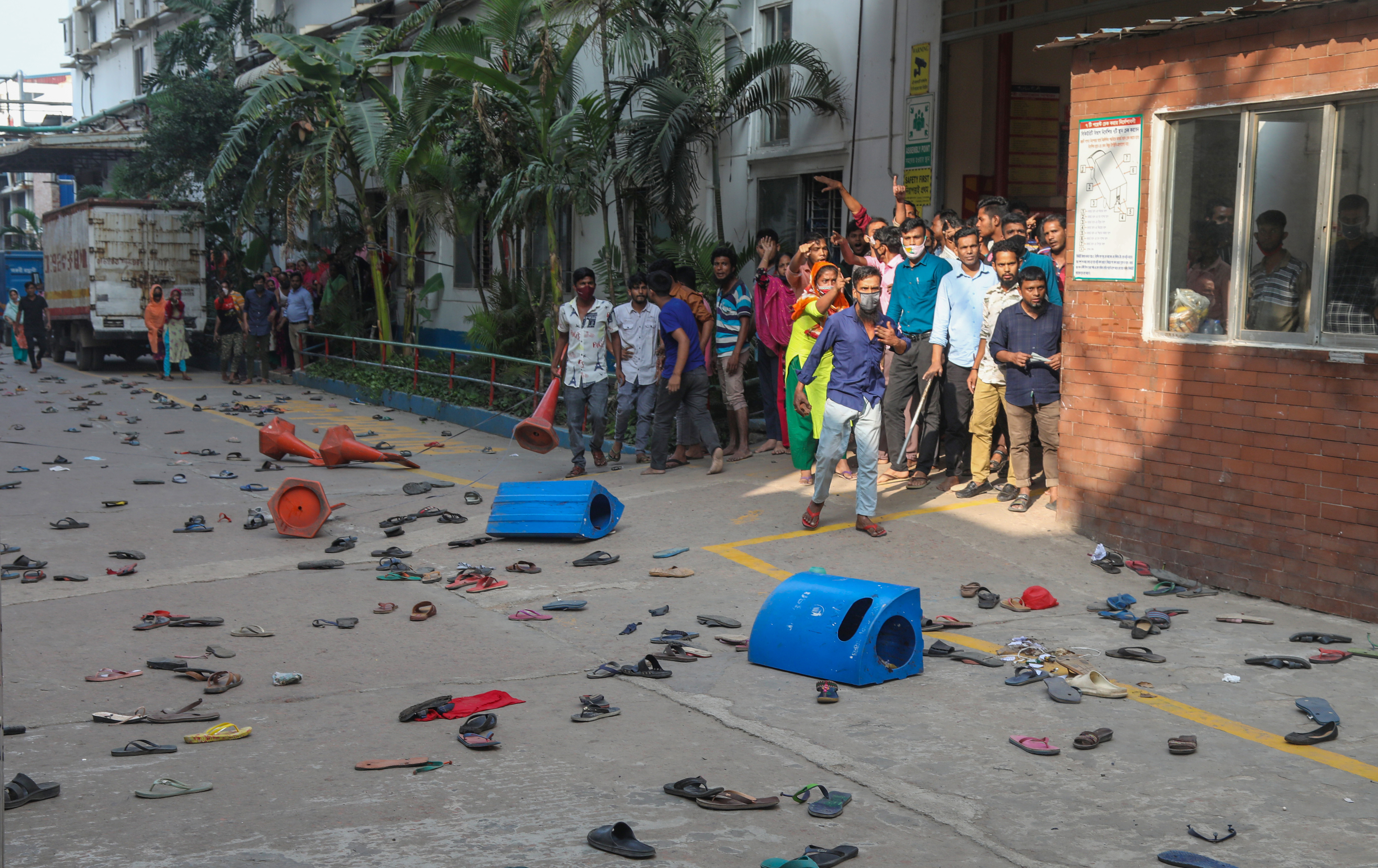Bangladeshi garment workers clash with security officials in Gazipur city, on the outskirts of Dhaka, Bangladesh.