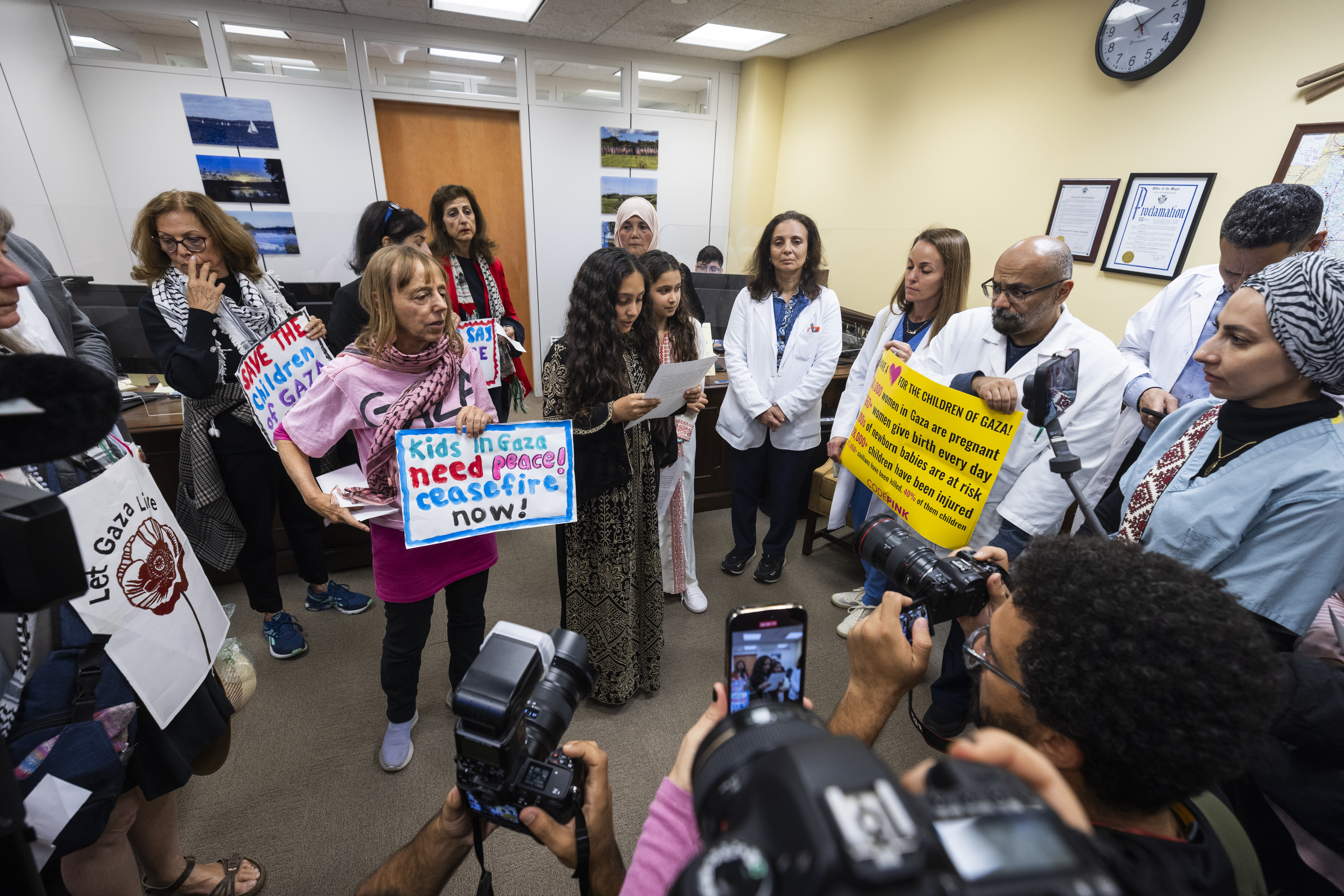 Activists from the American Palestinian Women's Association and CODEPINK gather in Democratic Senator from Wisconsin Tammy Baldwin's office to urge female Senators to call for an Israeli ceasefire in Gaza in the Hart Senate Office Building in Washington.