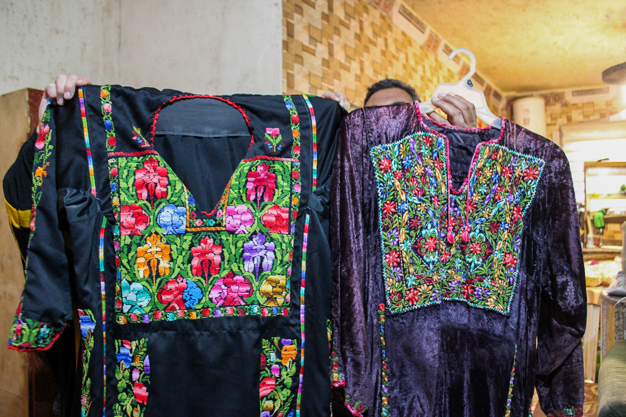 Showing traditional Palestinian thobes