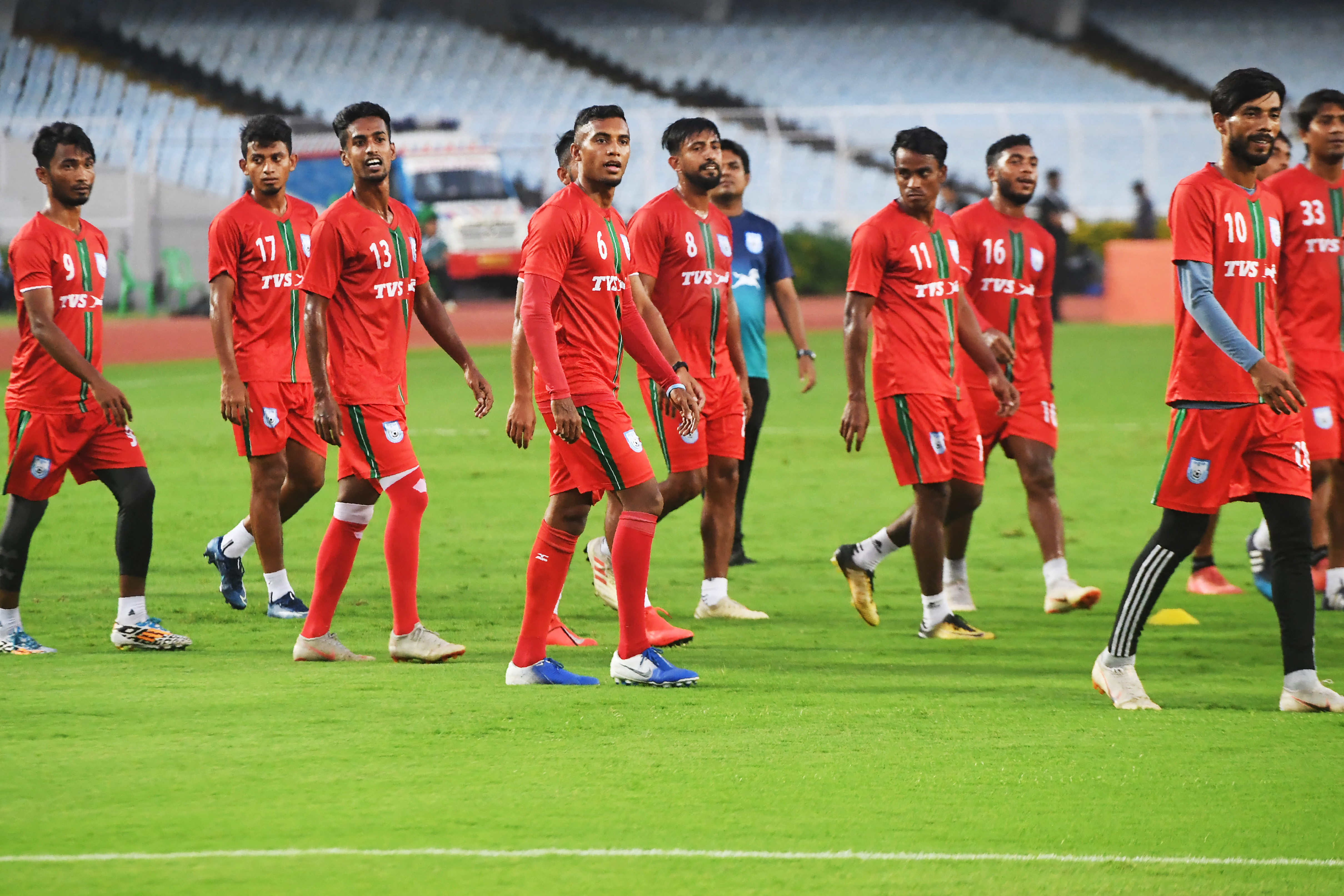 Bangladesh's national football team captain Jamal Bhuyan (4L) takes part in a training session with teammates 