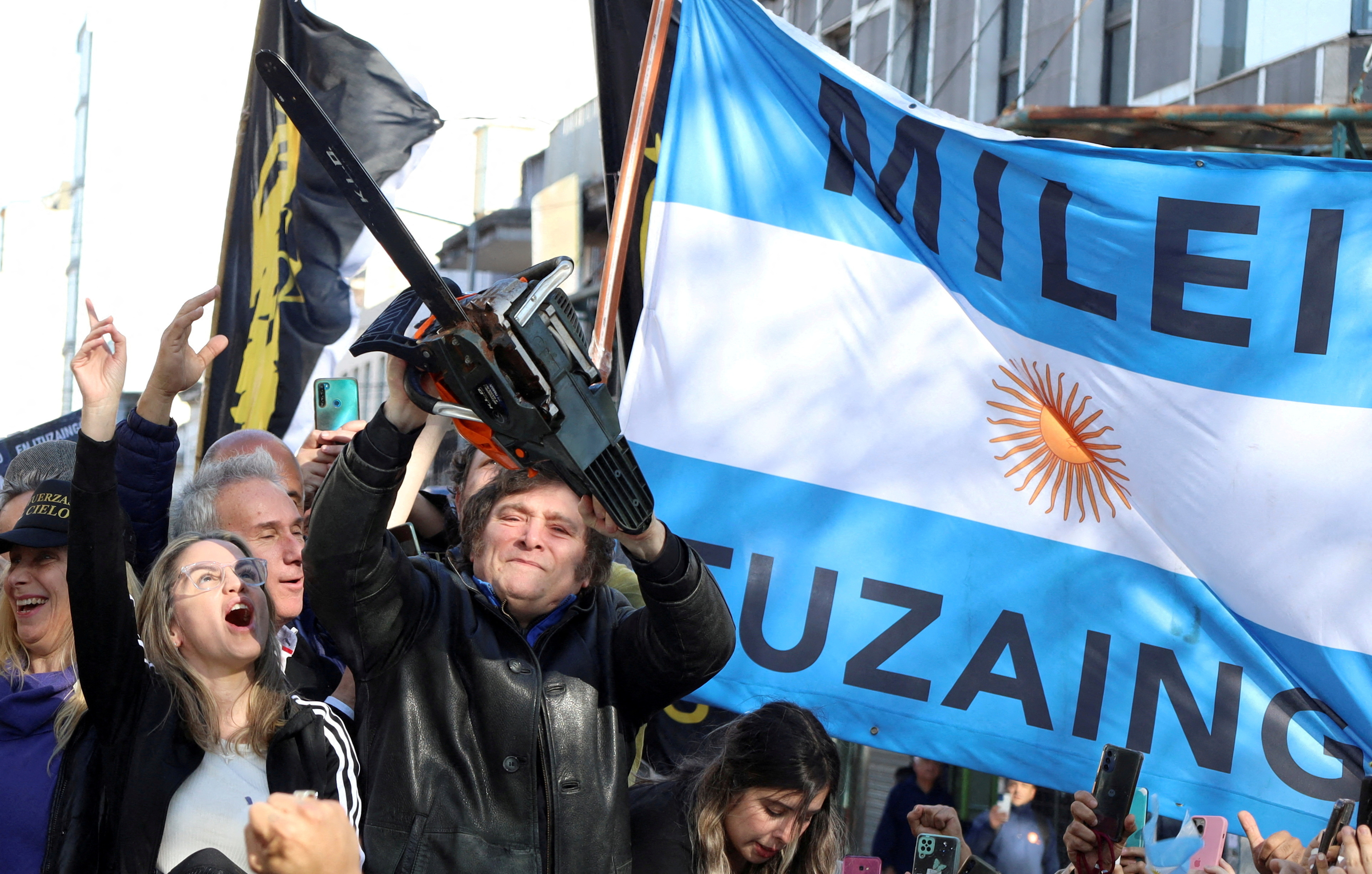 rgentine presidential candidate Javier Milei holds a chainsaw next to Carolina Piparo, candidate for Governor of the Province of Buenos Aires