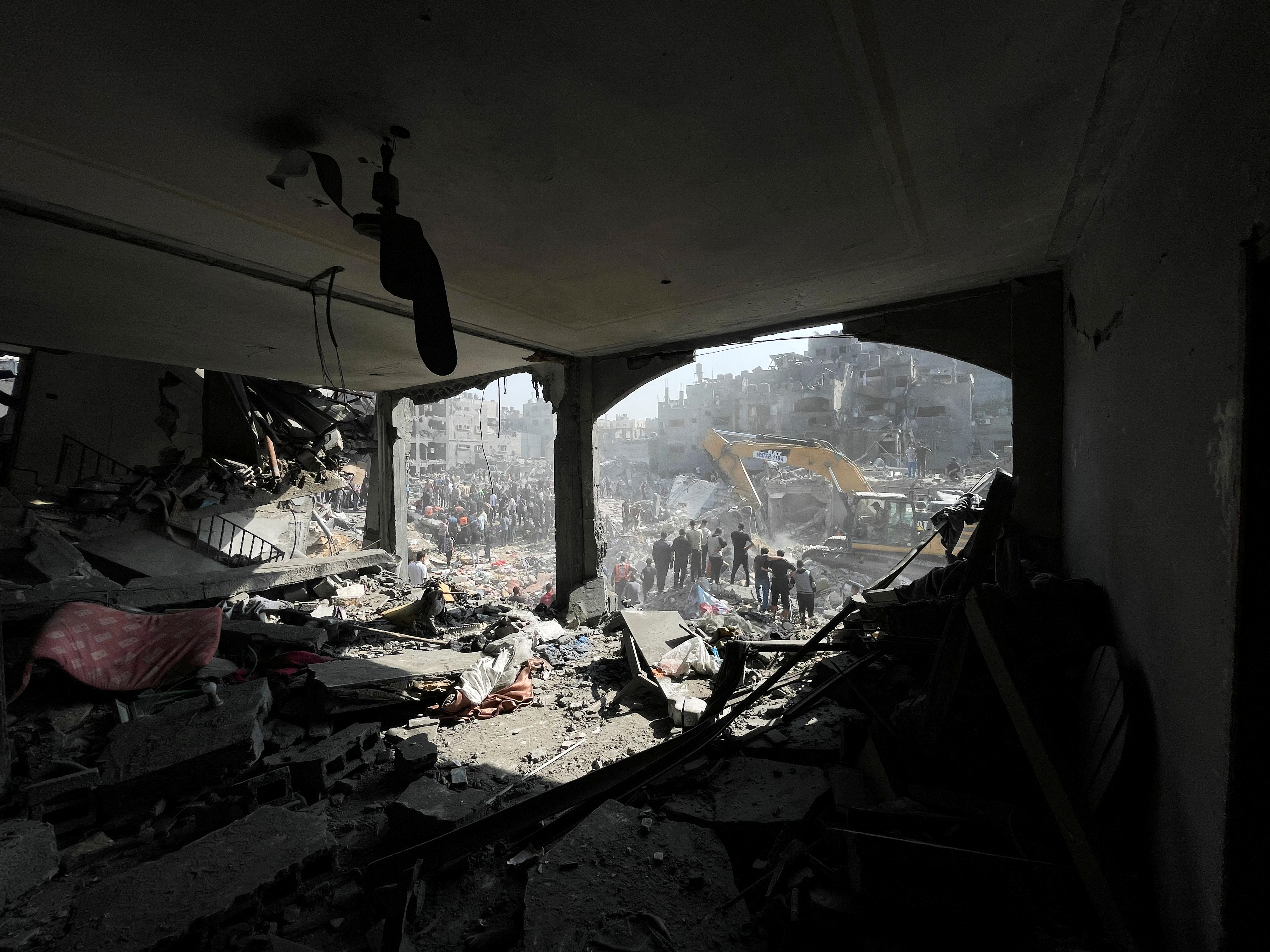 Palestinians search for casualties a day after Israeli strikes on houses in Jabalia refugee camp in the northern Gaza Strip.