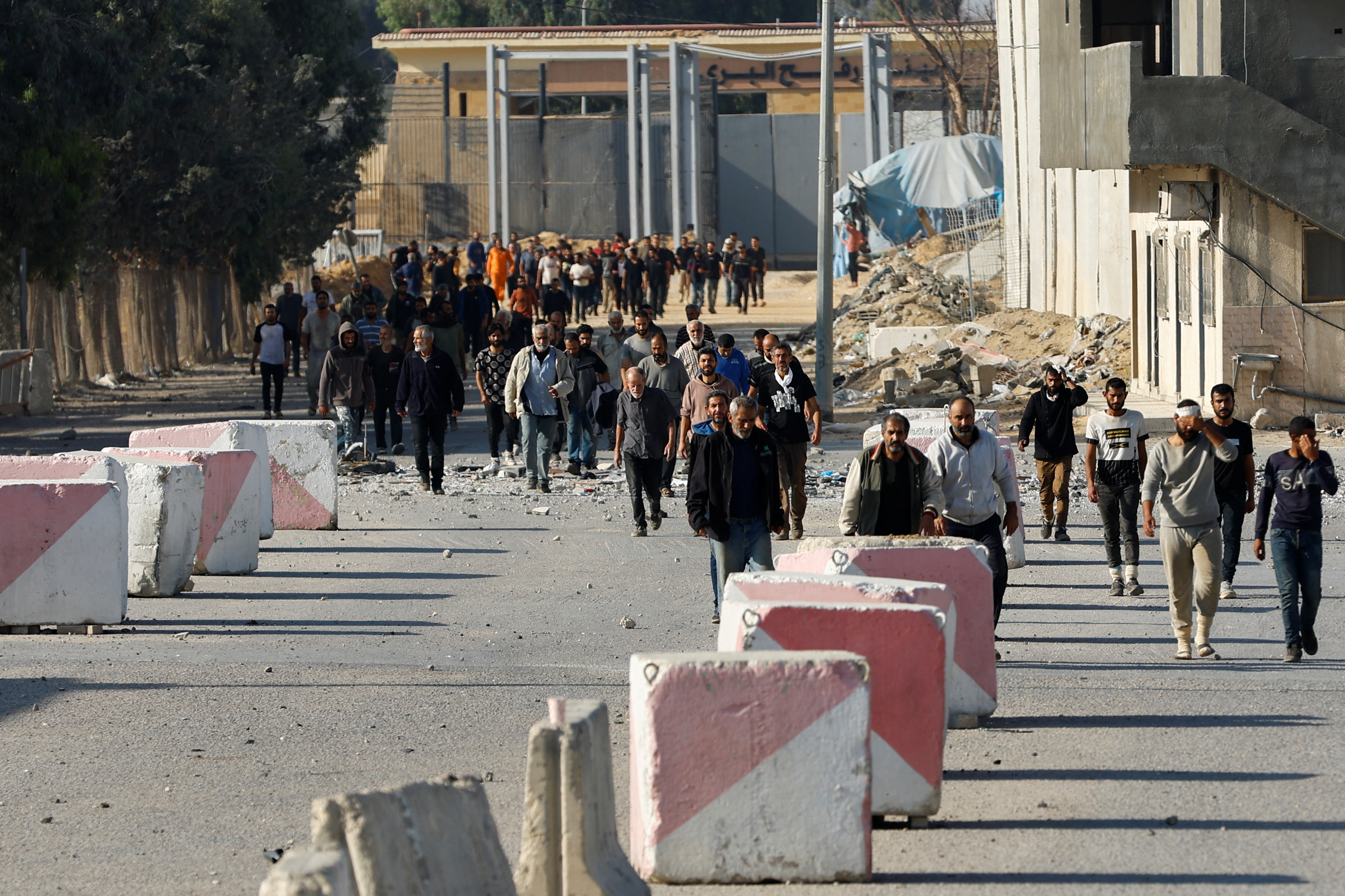 Palestinian labourers, who were in Israel during the Hamas October 7 attack, arrive at the Rafah border after being sent back by Israel to the strip, in the southern Gaza Strip, November 3, 2023.