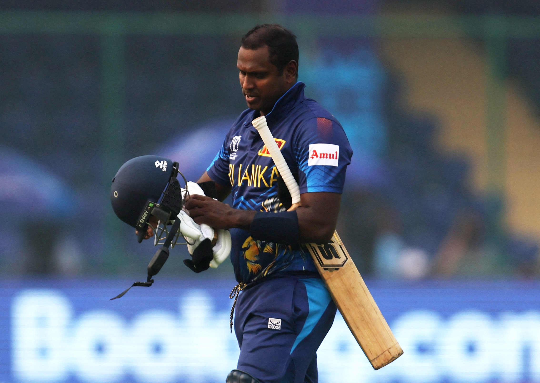 Sri Lanka's Angelo Mathews walks after losing his wicket