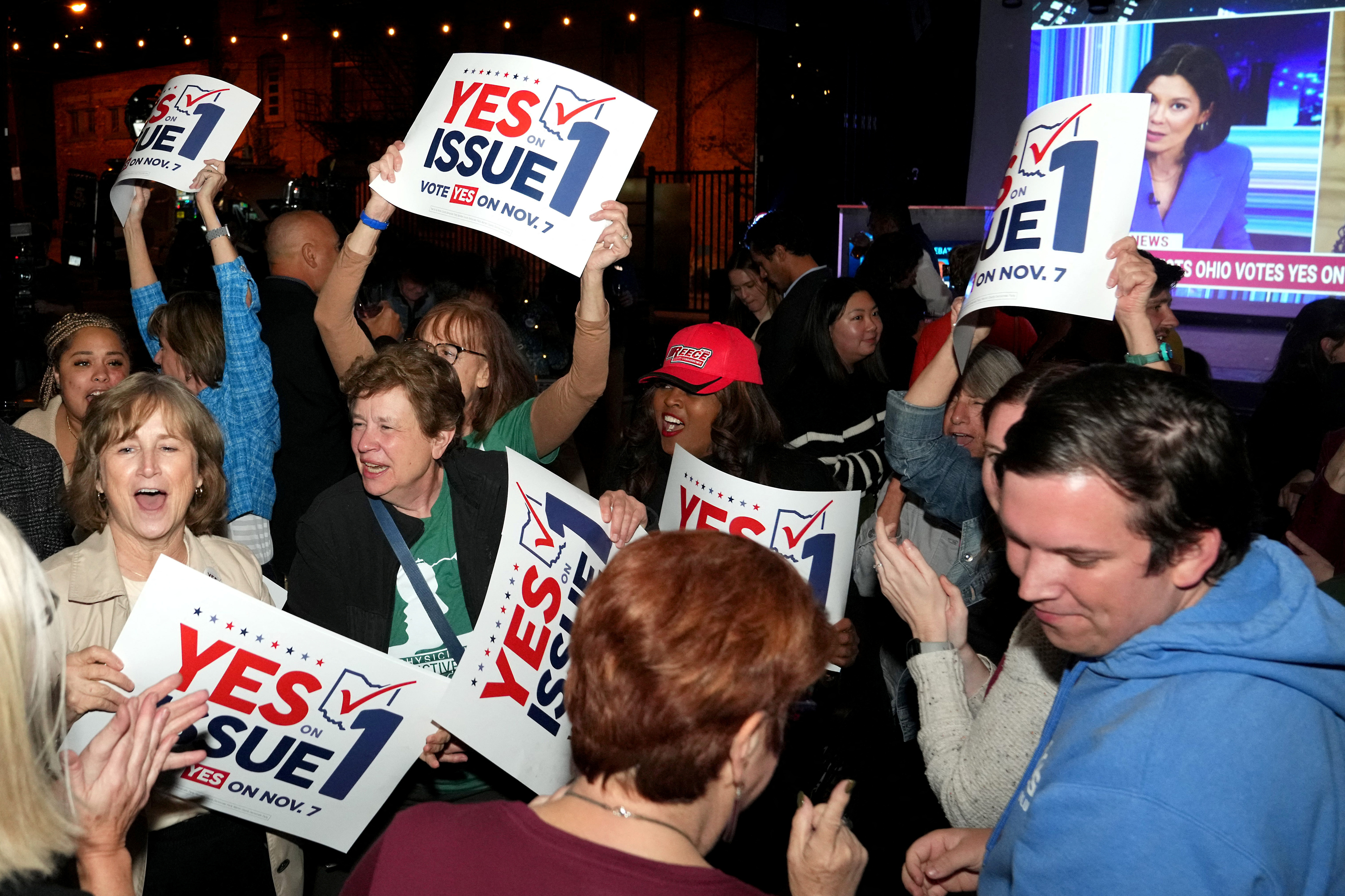 Supporters react to the passage of Ohio Issue 1, a ballot measure to amend the state constitution and establish a right to abortion, at an election night party hosted by the Hamilton County Democratic Party at Knox Joseph Distillery in the Over-the-Rhine neighborhood of Cincinnati, Ohio, U.S. November 7, 2023. Kareem Elgazzar/USA Today Network via REUTERS. NO RESALES. NO ARCHIVES. MANDATORY CREDIT