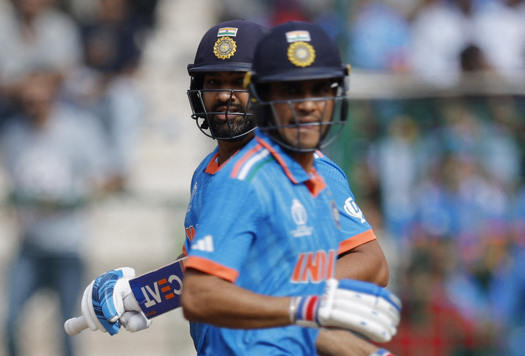 Cricket - ICC Cricket World Cup 2023 - India v Netherlands - M. Chinnaswamy Stadium, Bengaluru, India - November 12, 2023 India's Shubman Gill and Rohit Sharma in action REUTERS/Adnan Abidi