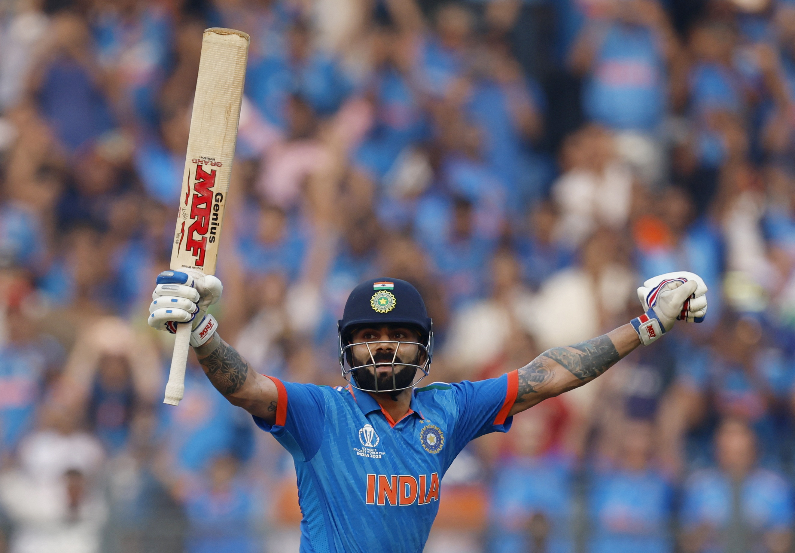 Cricket - ICC Cricket World Cup 2023 - Semi-Final - India v New Zealand - Wankhede Stadium, Mumbai, India - November 15, 2023 India's Virat Kohli celebrates after reaching his 50th century, breaking Sachin Tendulkar's record of most number of ODI centuries REUTERS/Adnan Abidi