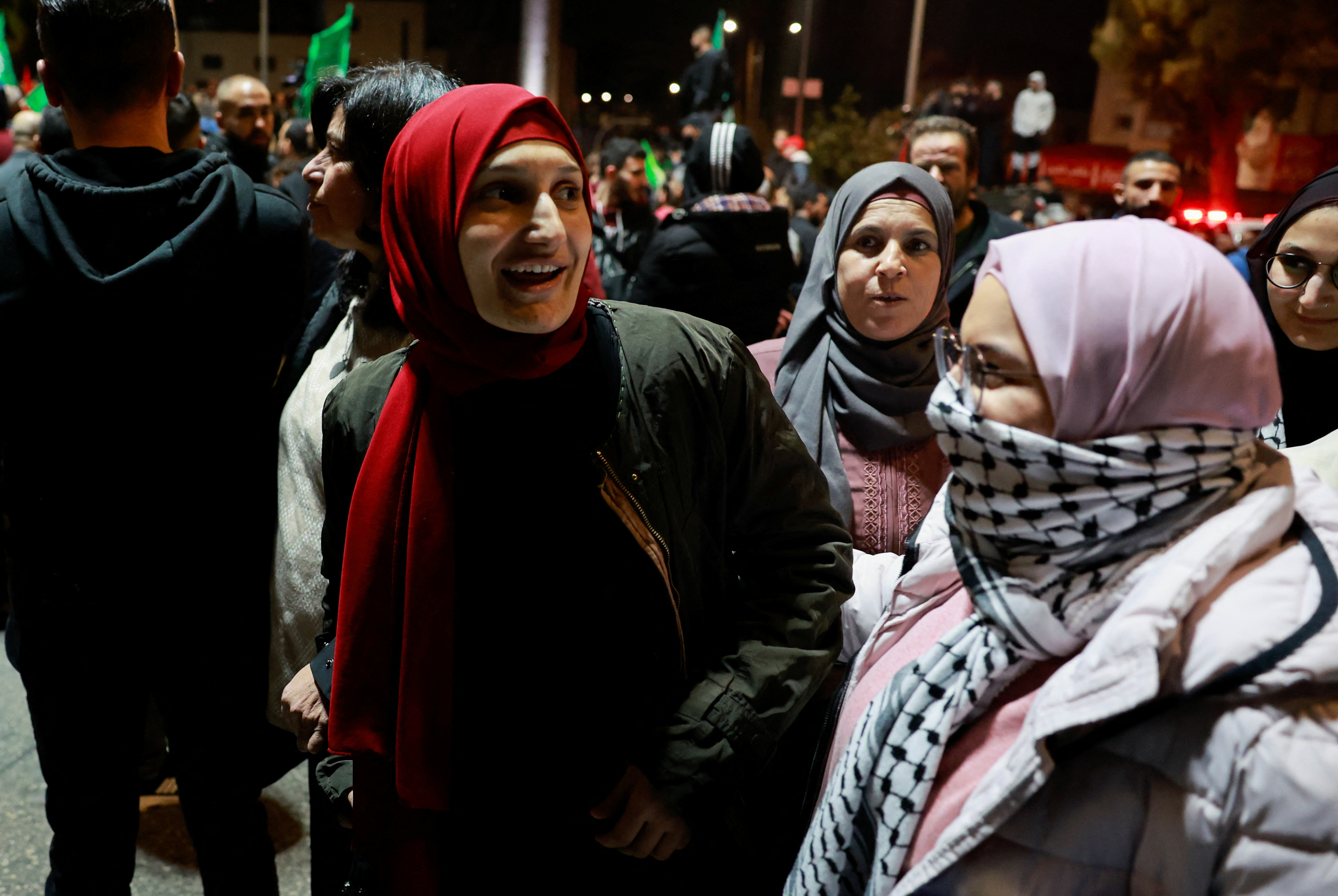 People react as Palestinian prisoners leave after being released from the Israeli military prison, Ofer, amid a hostages-prisoners swap deal between Hamas and Israel, near Ramallah in the Israeli-occupied West Bank November 26