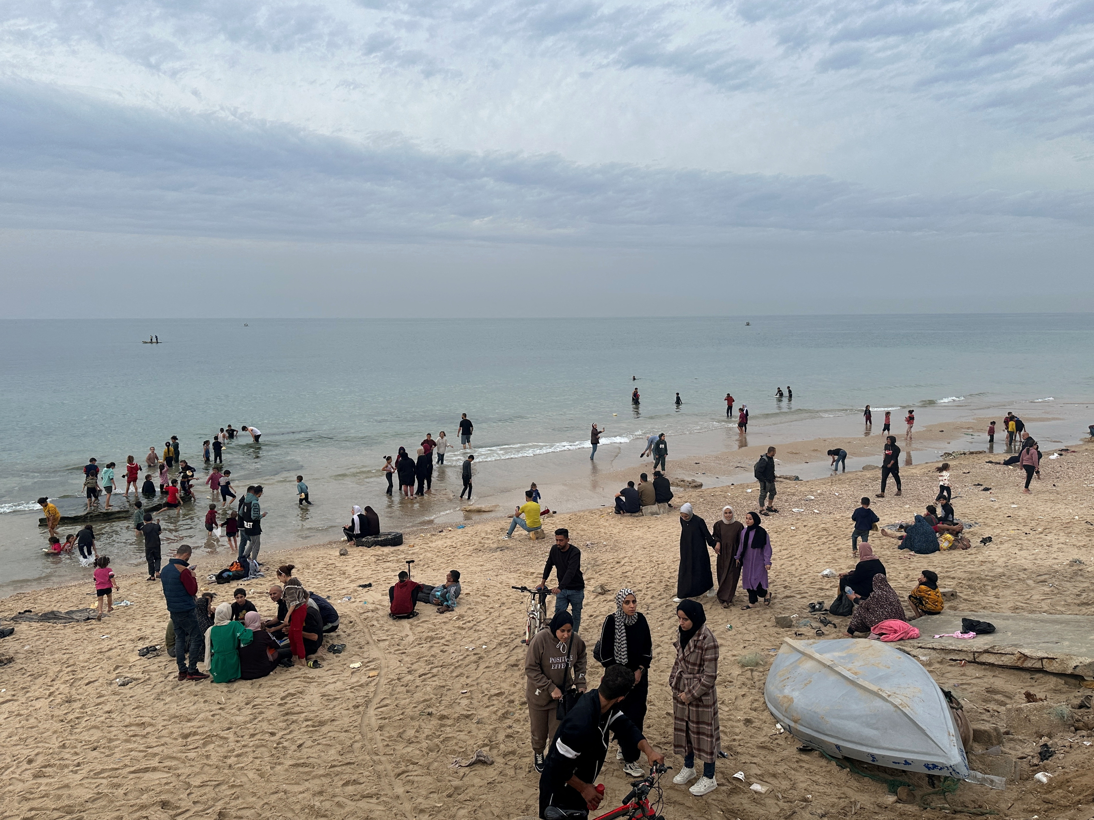 Palestinians spend time on a beach during a temporary truce between Hamas and Israel, in Deir al-Balah in the central Gaza Strip November 25, 2023