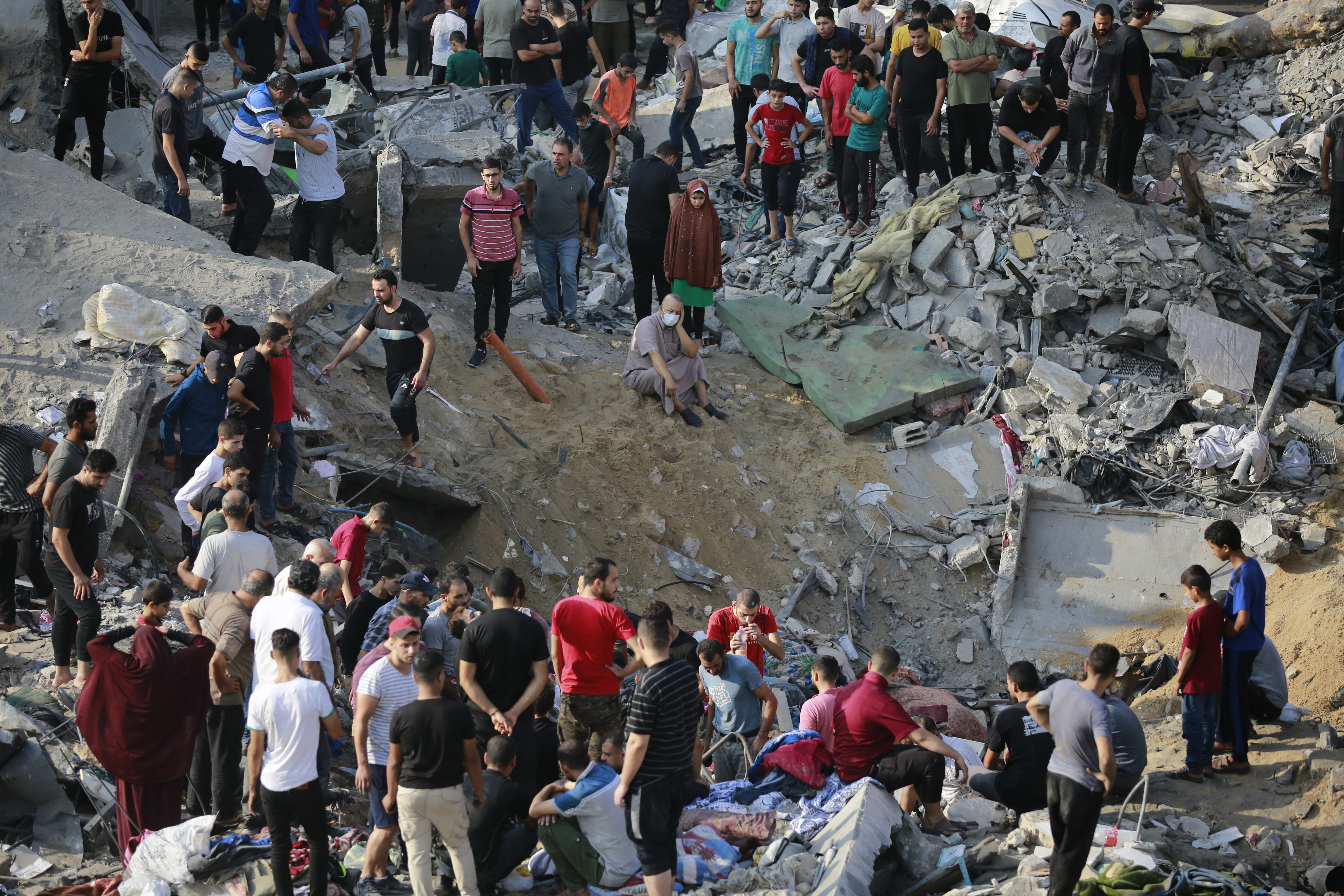 Palestinians check the destruction in the aftermath of an Israeli strike in the Jabalia camp for Palestinian refugees in the Gaza Strip.