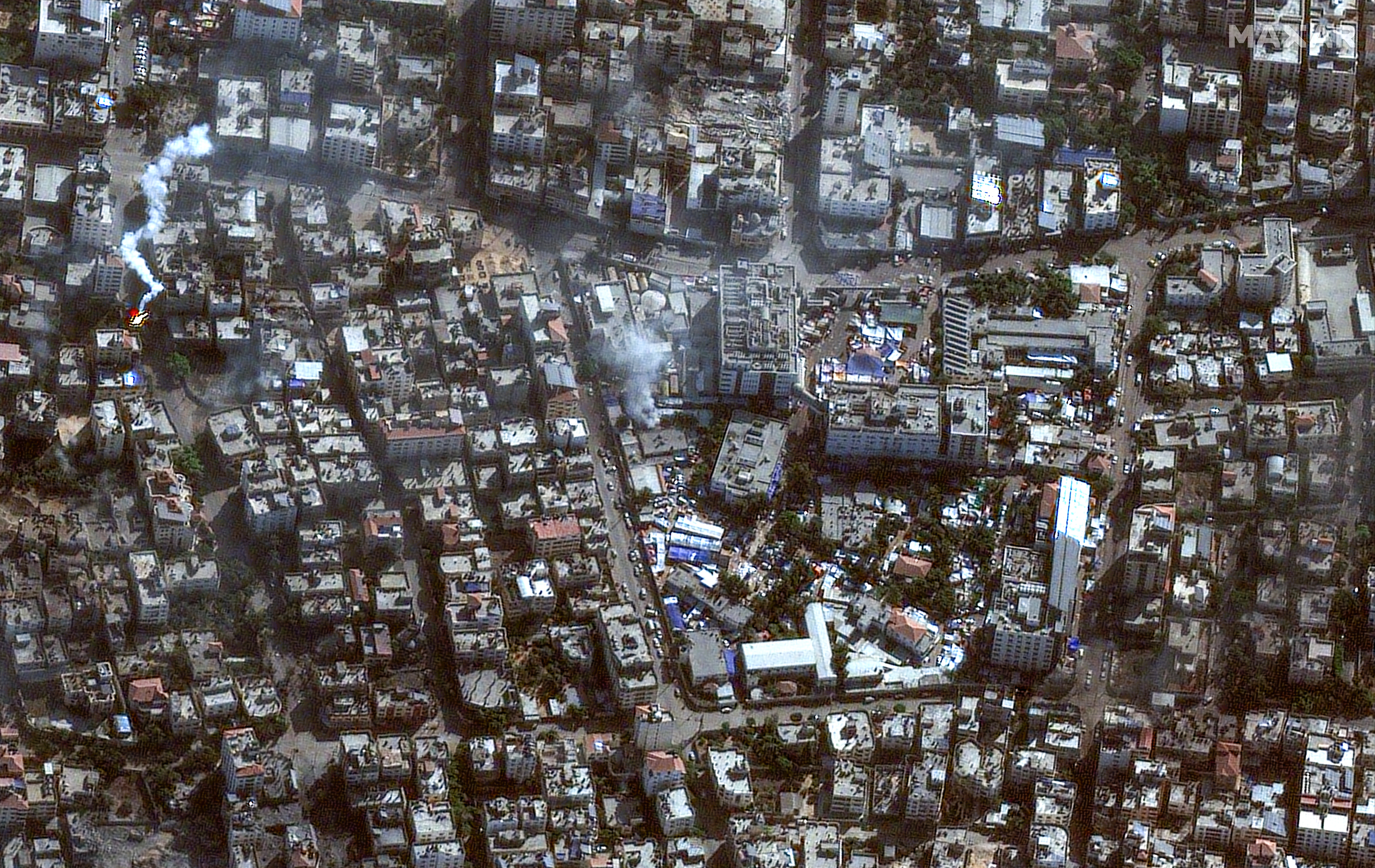 This handout satellite picture released by Maxar Technologies on November 12, 2023, shows the damage arround the Shifa Hospital in Gaza City's al-Rimal district.