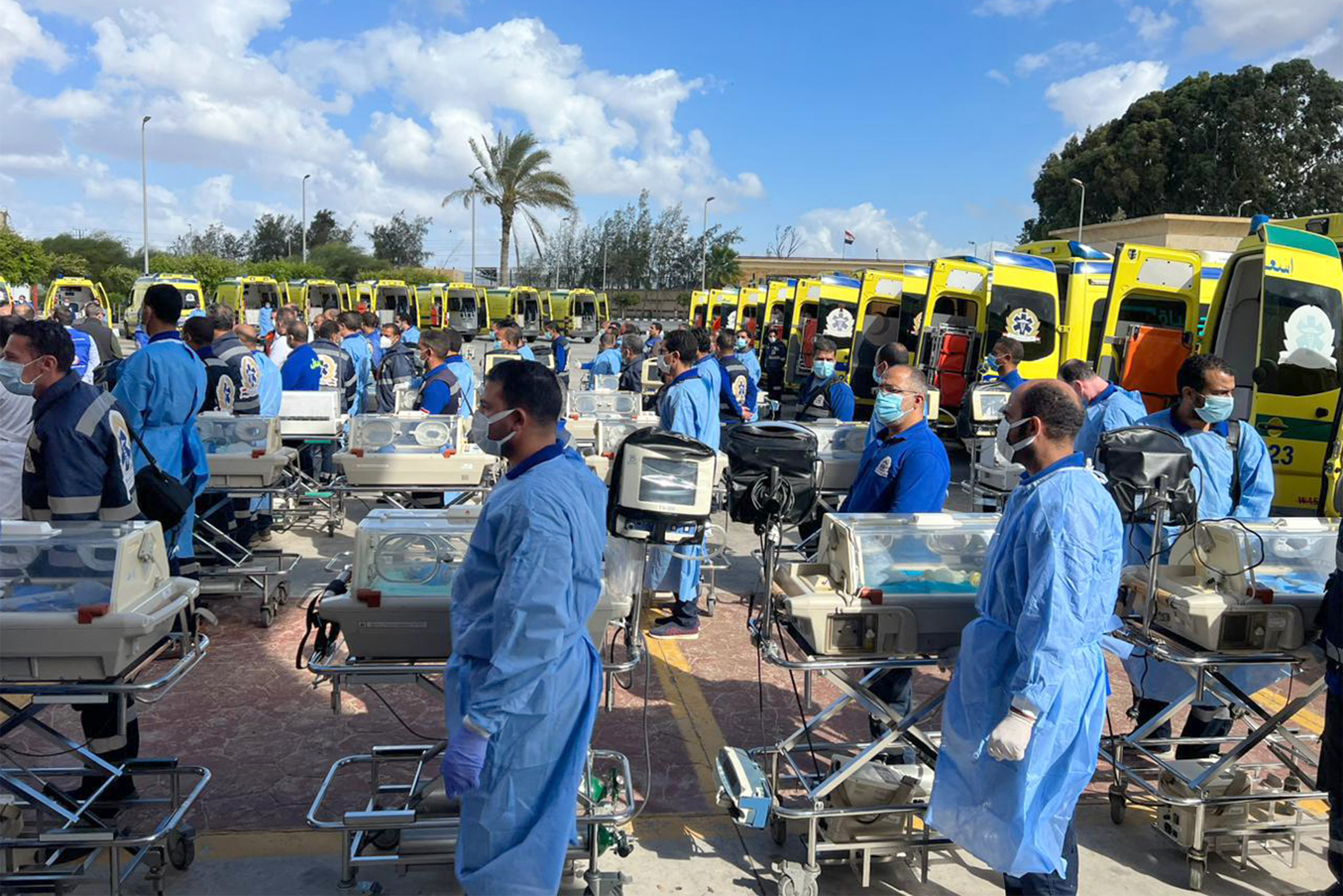 Egyptian medics stand by with incubators to receive premature Palestinian babies evacuated from Gaza on the Egyptian side of the Rafah border crossing with the Gaza Strip