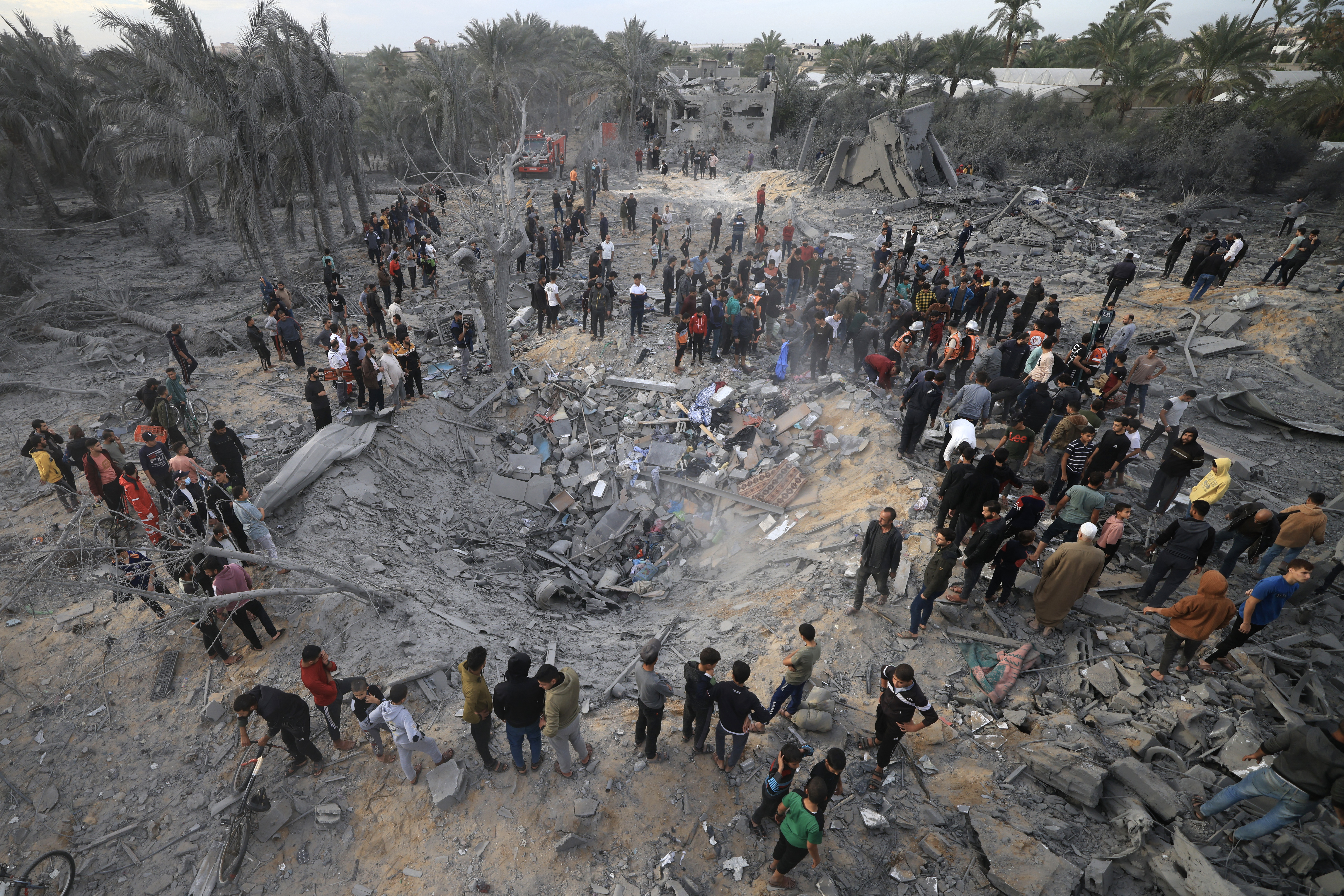 Palestinians inspect the damage after an Israeli strike on a house in Khan Yunis, in the southern Gaza Strip.