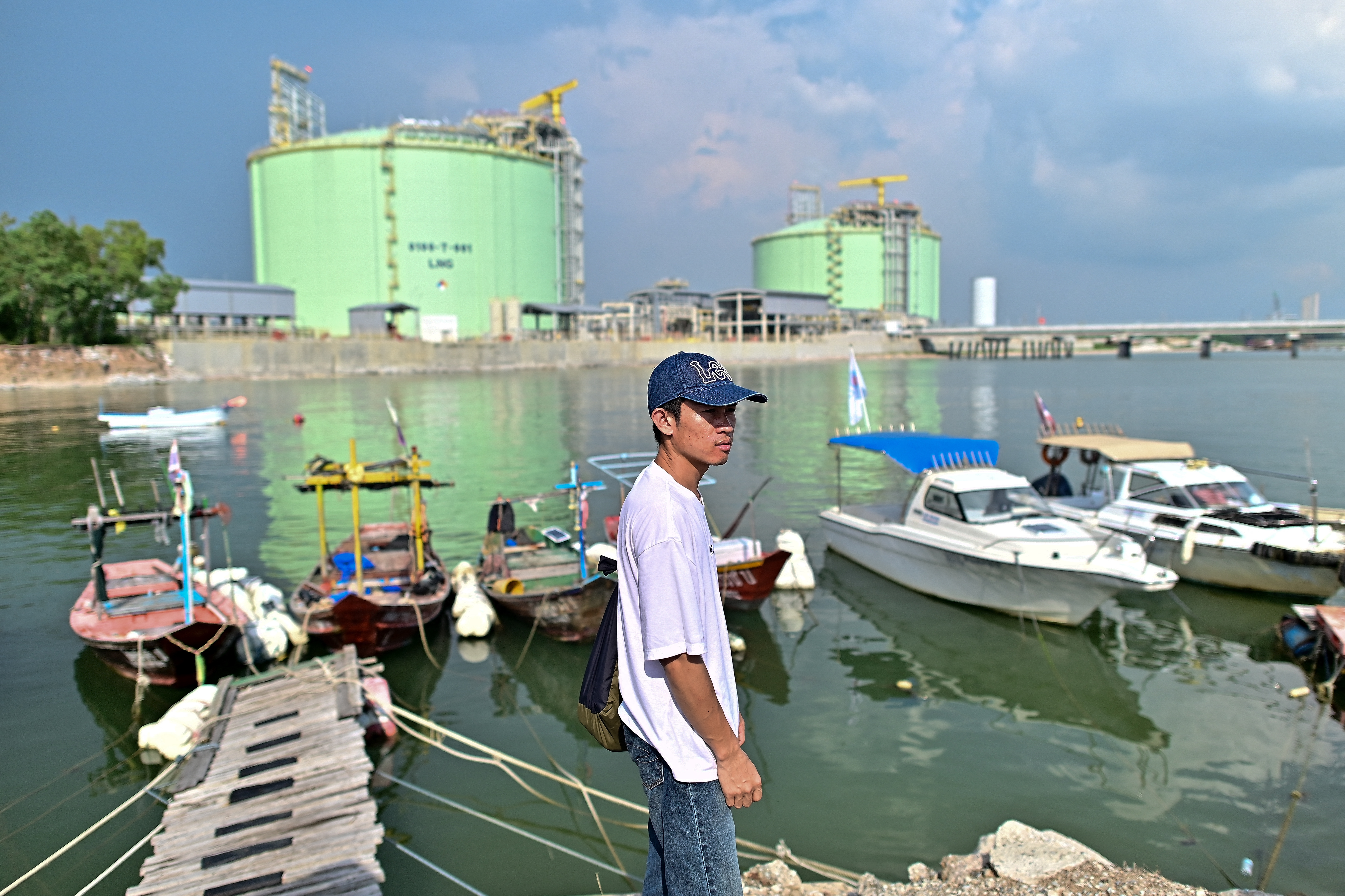 This photograph taken on November 7, 2023 shows Kino Khanhthamaly (C), an environmentalist working in Laos, during a EarthRights School field trip in the coastal Thai province of Rayong.
