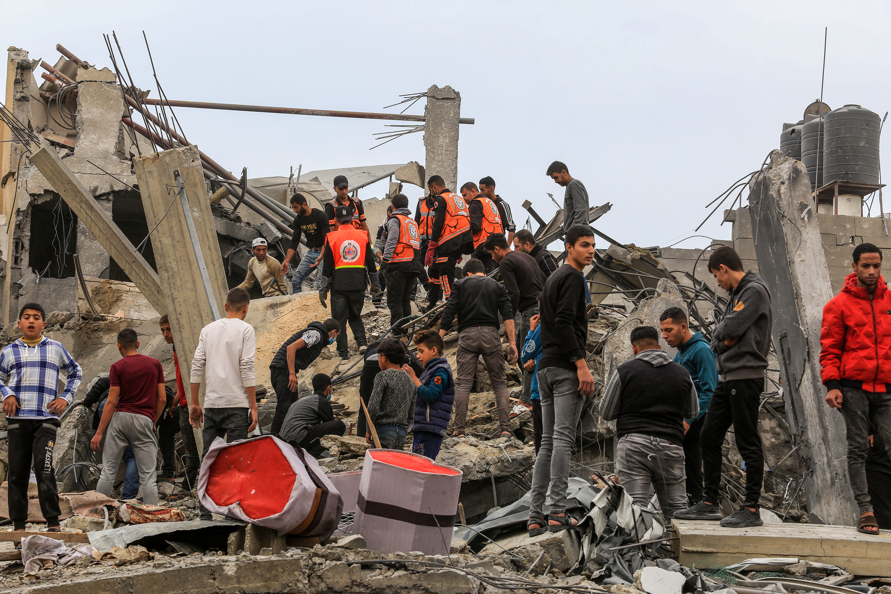 Civil defense team and civilians make search and rescue efforts following an Israeli attack on a house belonging to the Oveyda family on the 47th day of the conflict in Rafah, Gaza.