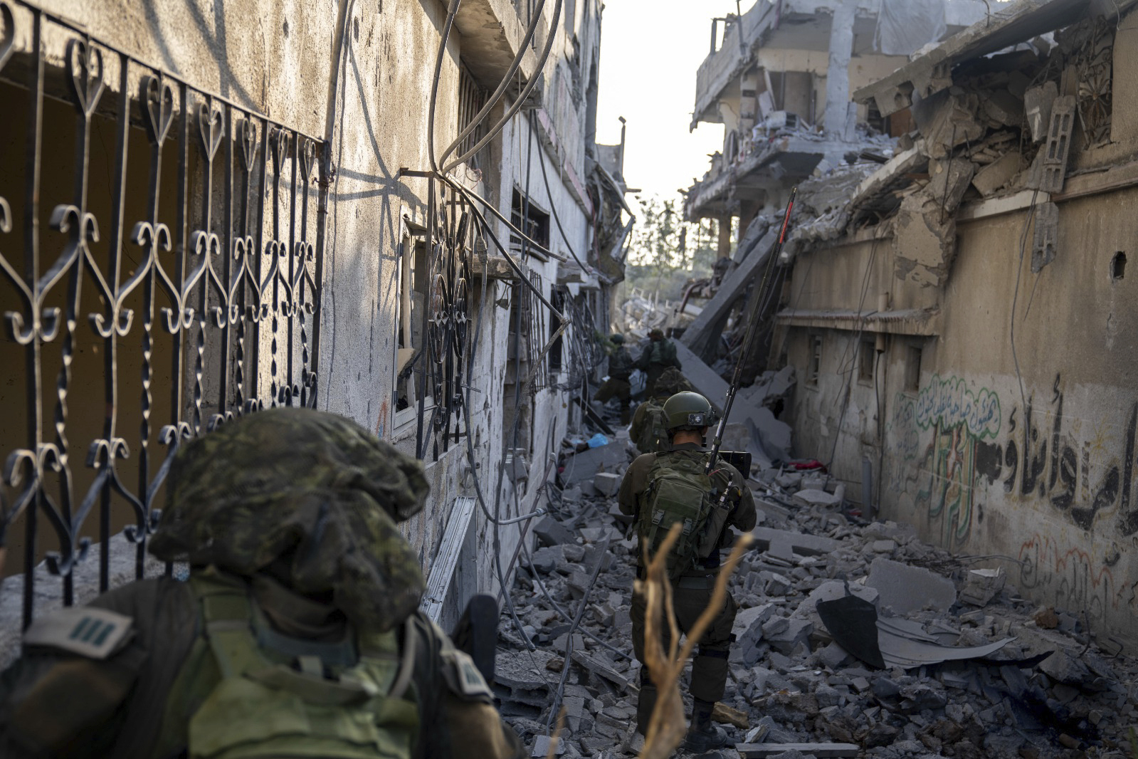 In this undated image provided by the Israeli military, soldiers take part in their ground campaign in the Gaza Strip.