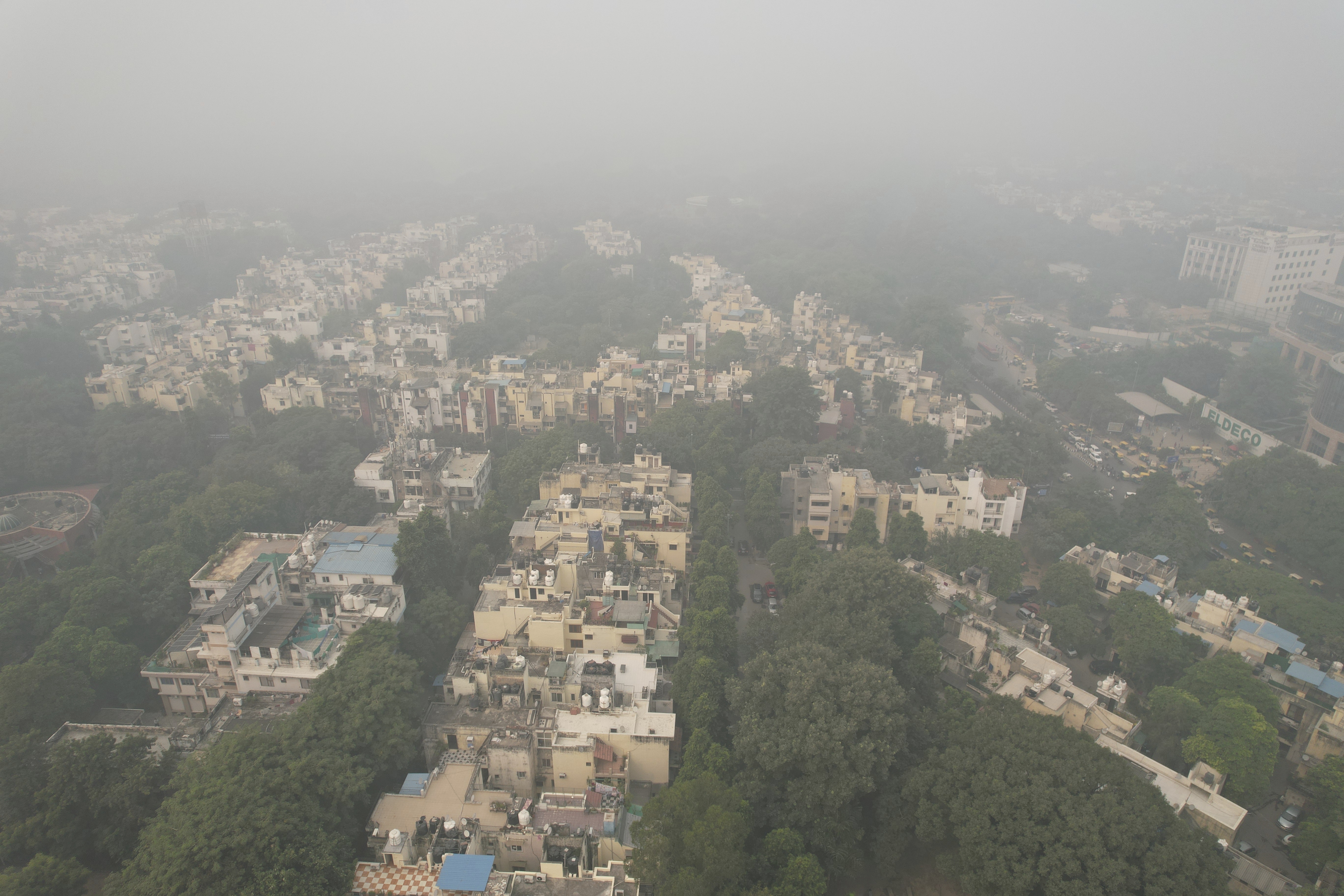 The city skyline is enveloped by smog and fog in New Delhi