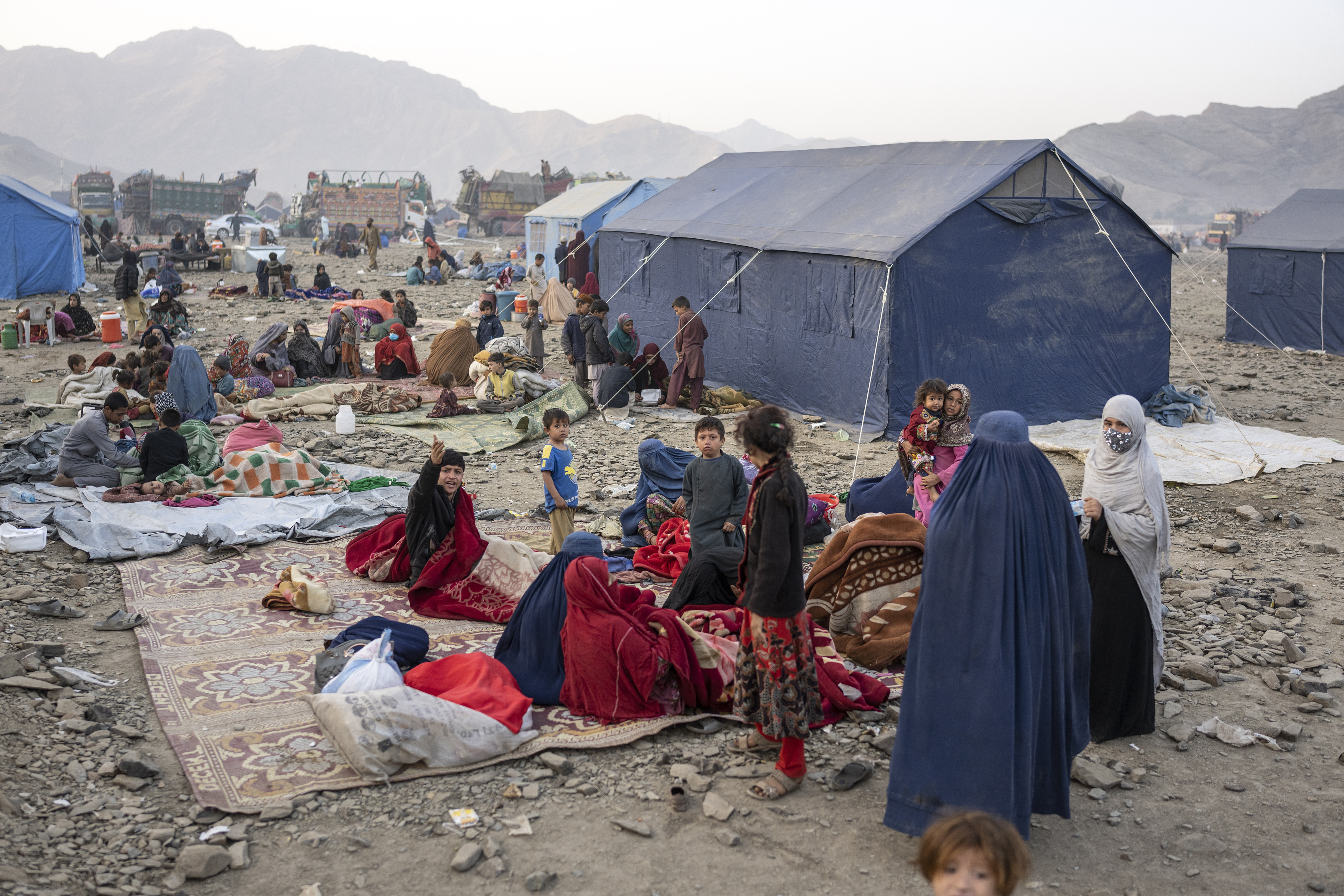 Afghan refugees settle in a camp near the Torkham Pakistan-Afghanistan border in Torkham, Afghanistan, Saturday.