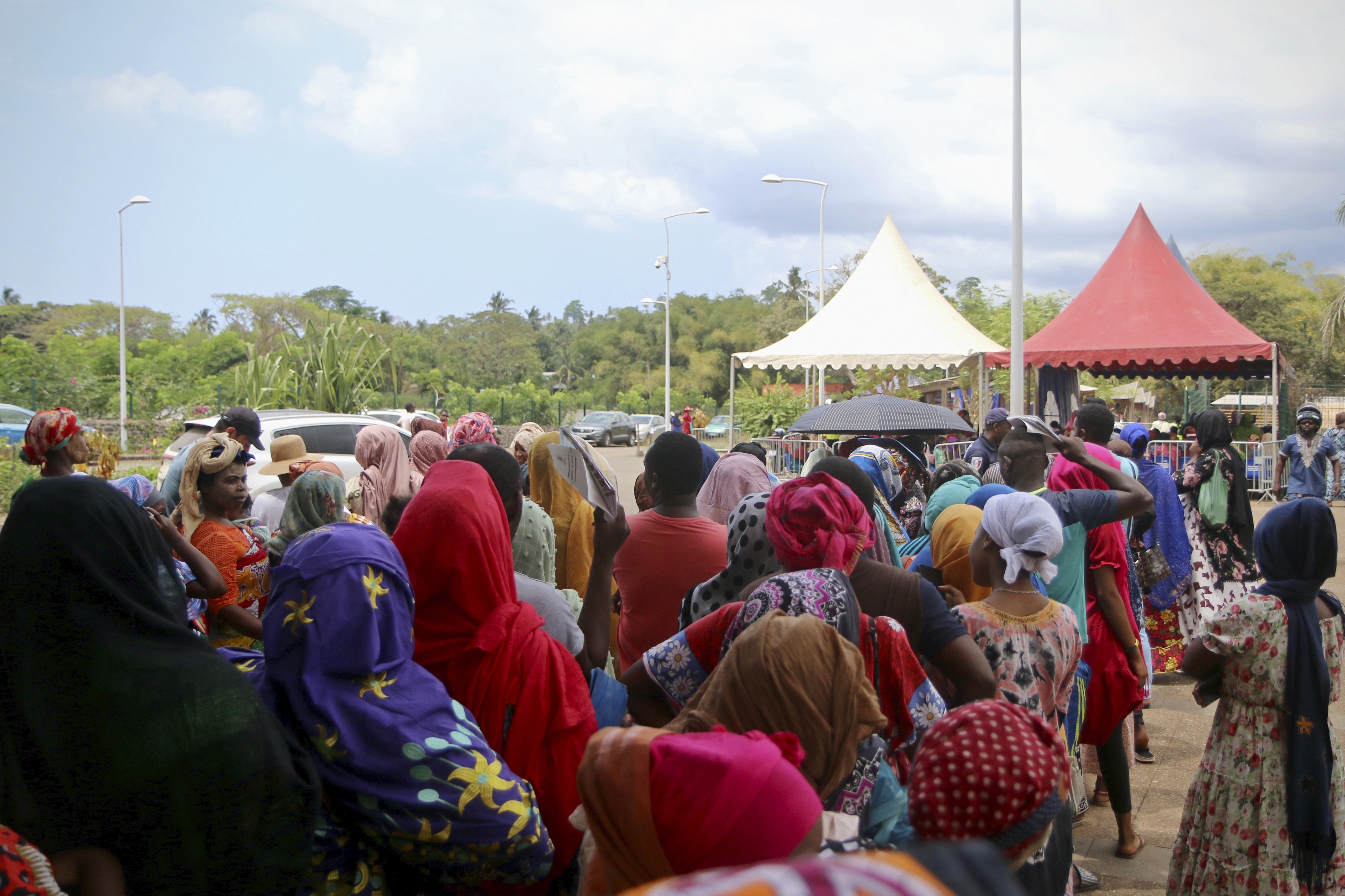 Residents queue for water in Tsoundzou, on the French Indian Ocean territory of Mayotte, Saturday,