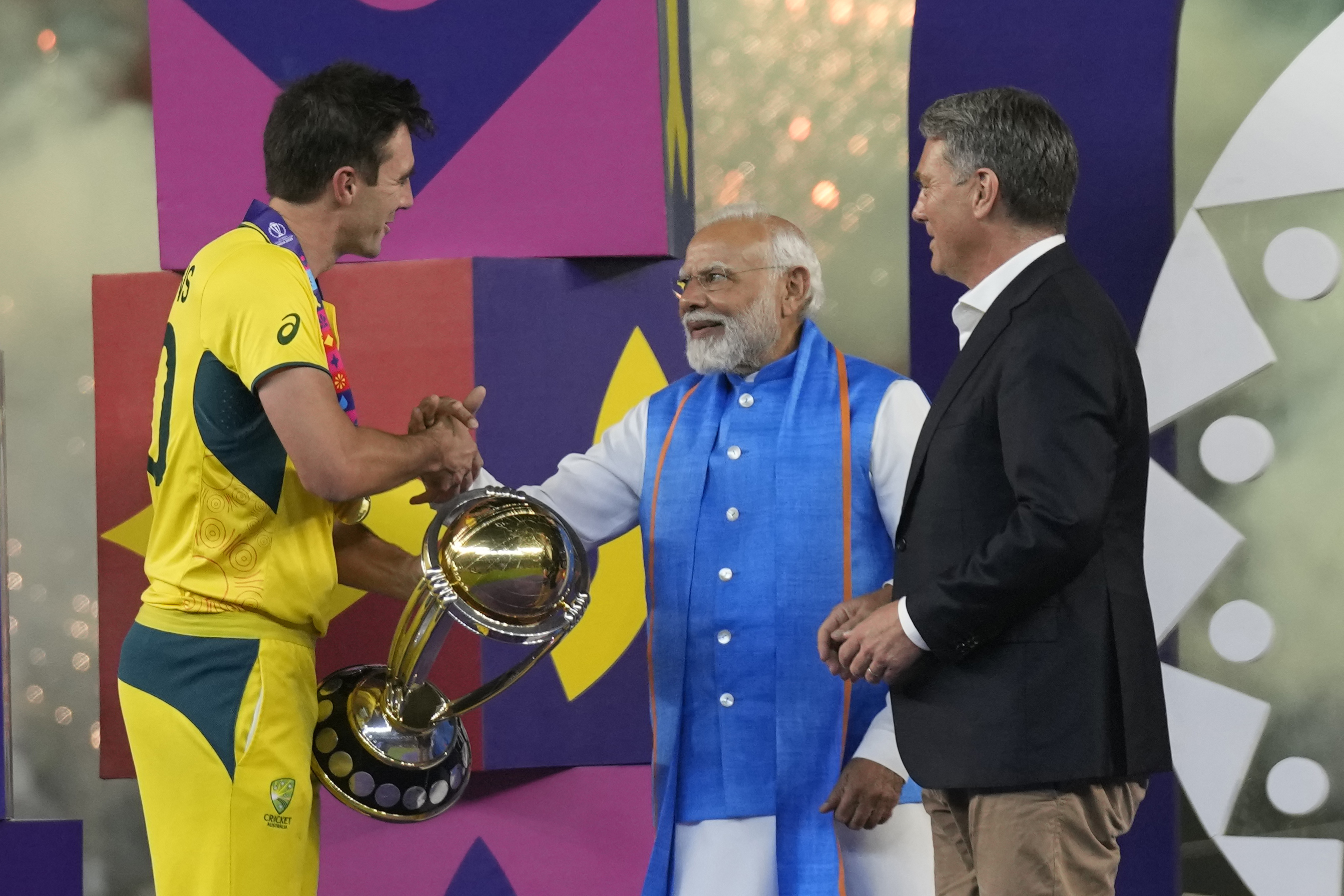 Indian Prime Minister Narendra Modi and Australian Deputy Prime Minister Richard Marles, present ICC Men's Cricket World trophy to Australia's captain Pat Cummins after Australia won against India in the final match, in Ahmedabad, India.