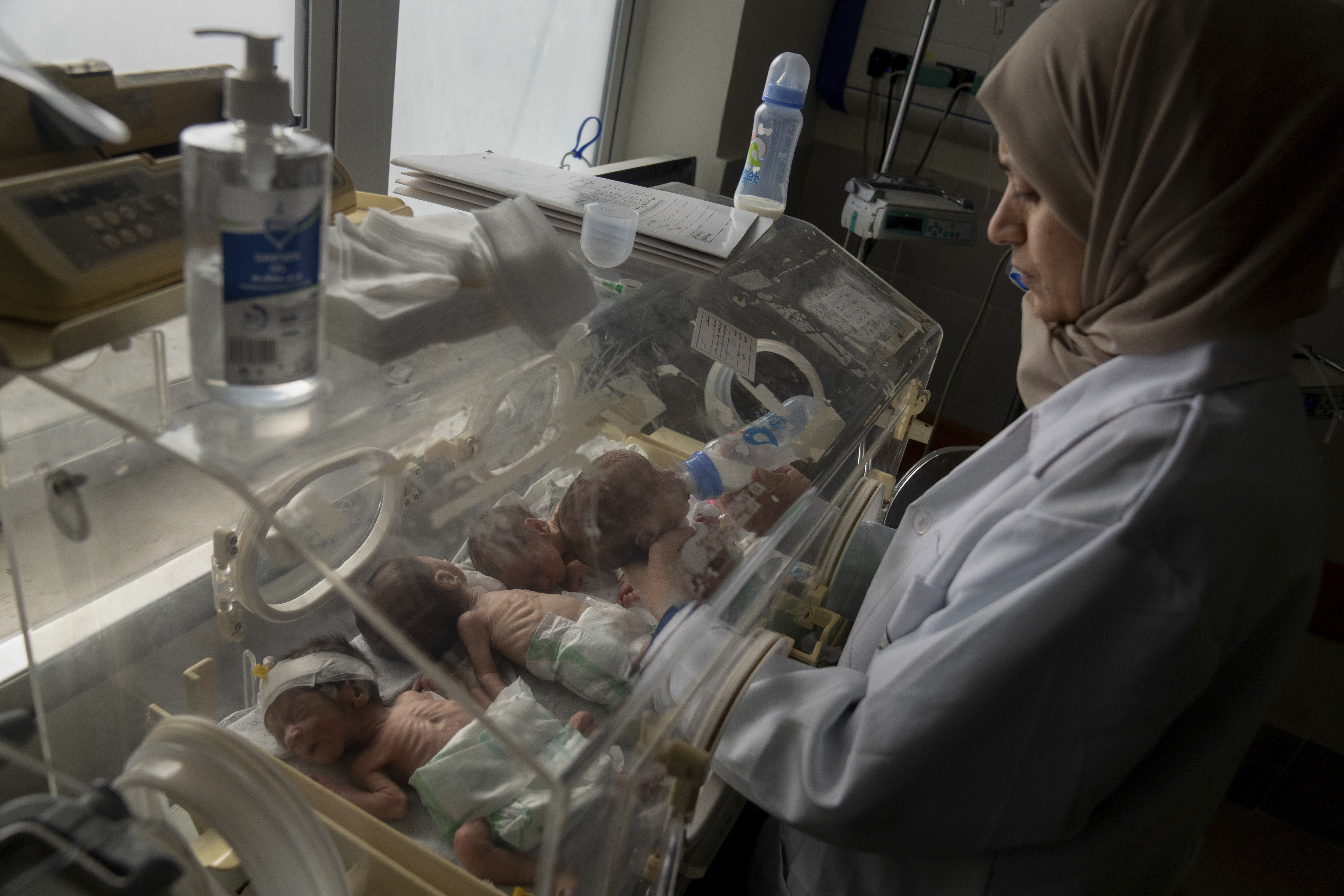 A nurse prepares premature babies for transport to Egypt after they were evacuated from Shifa Hospital in Gaza City to a hospital in Rafah
