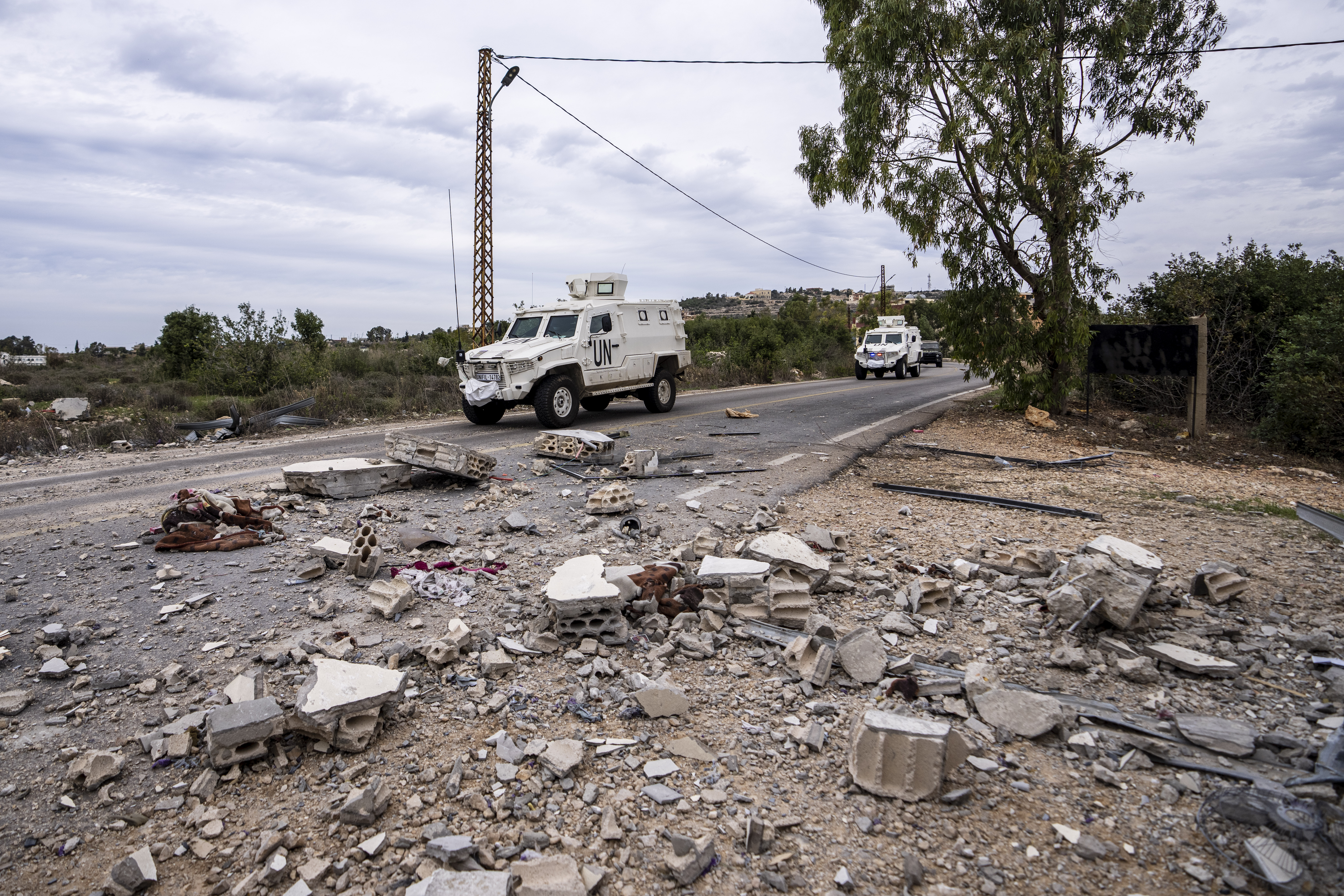U.N. peacekeepers patrol next to a damage house in the Lebanese side of the Lebanese-Israeli border in the southern village of Marwahin, Lebanon.