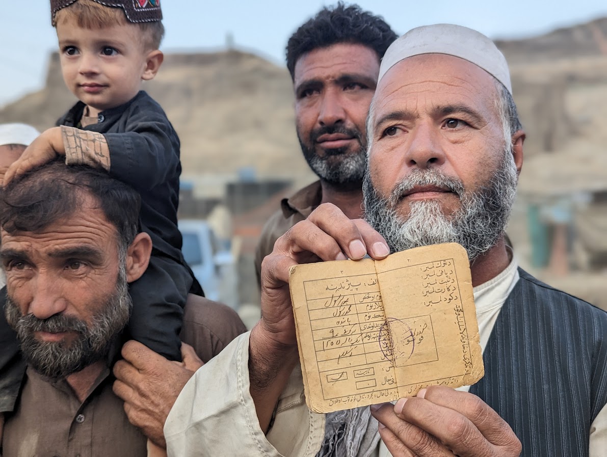 Abdul Rasul showing his Afghan ID documentation when he was a child in Afghanistan-1699011573