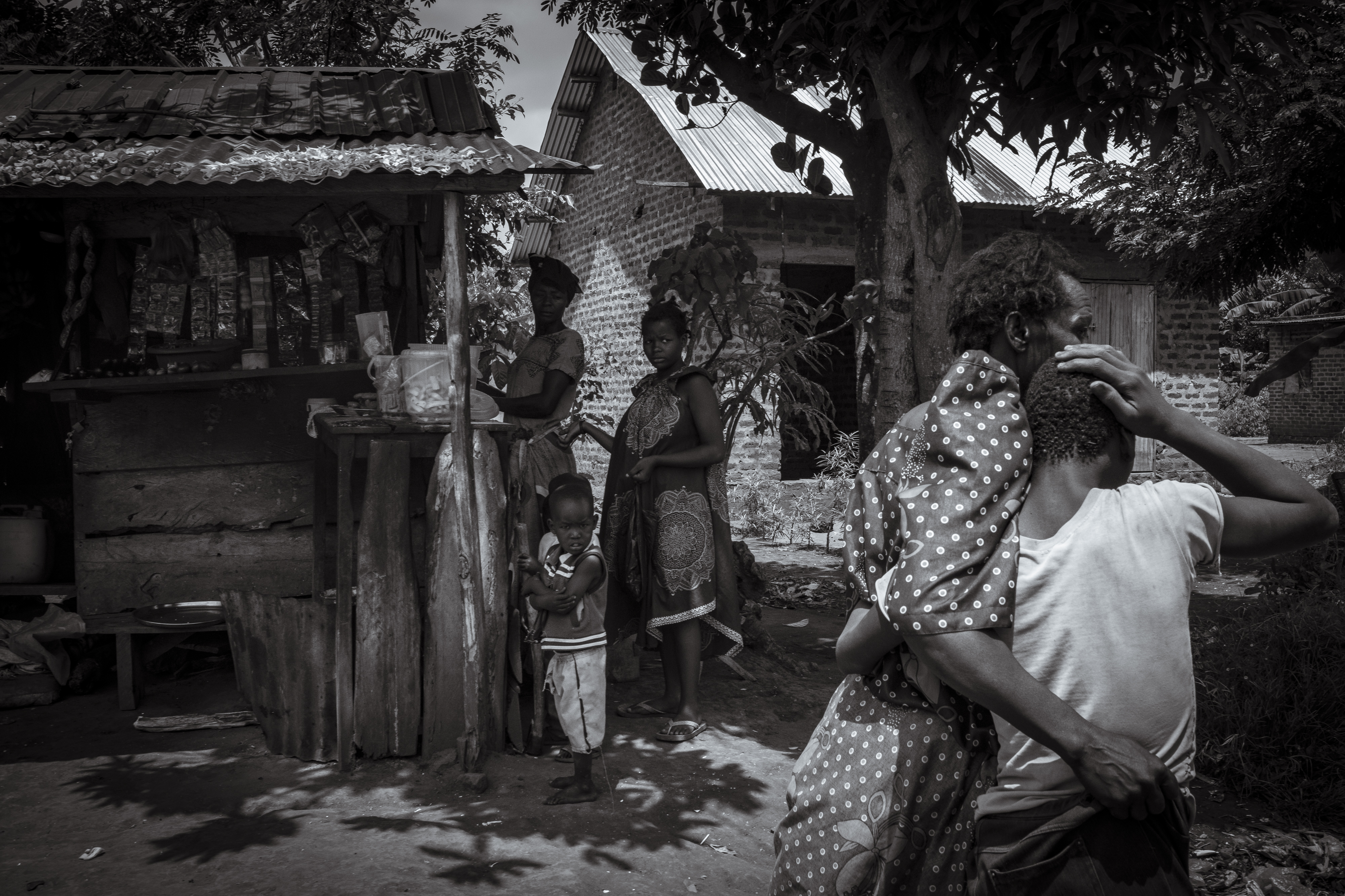 Lovinsa Namwebya comforts her son Perez Mbwase