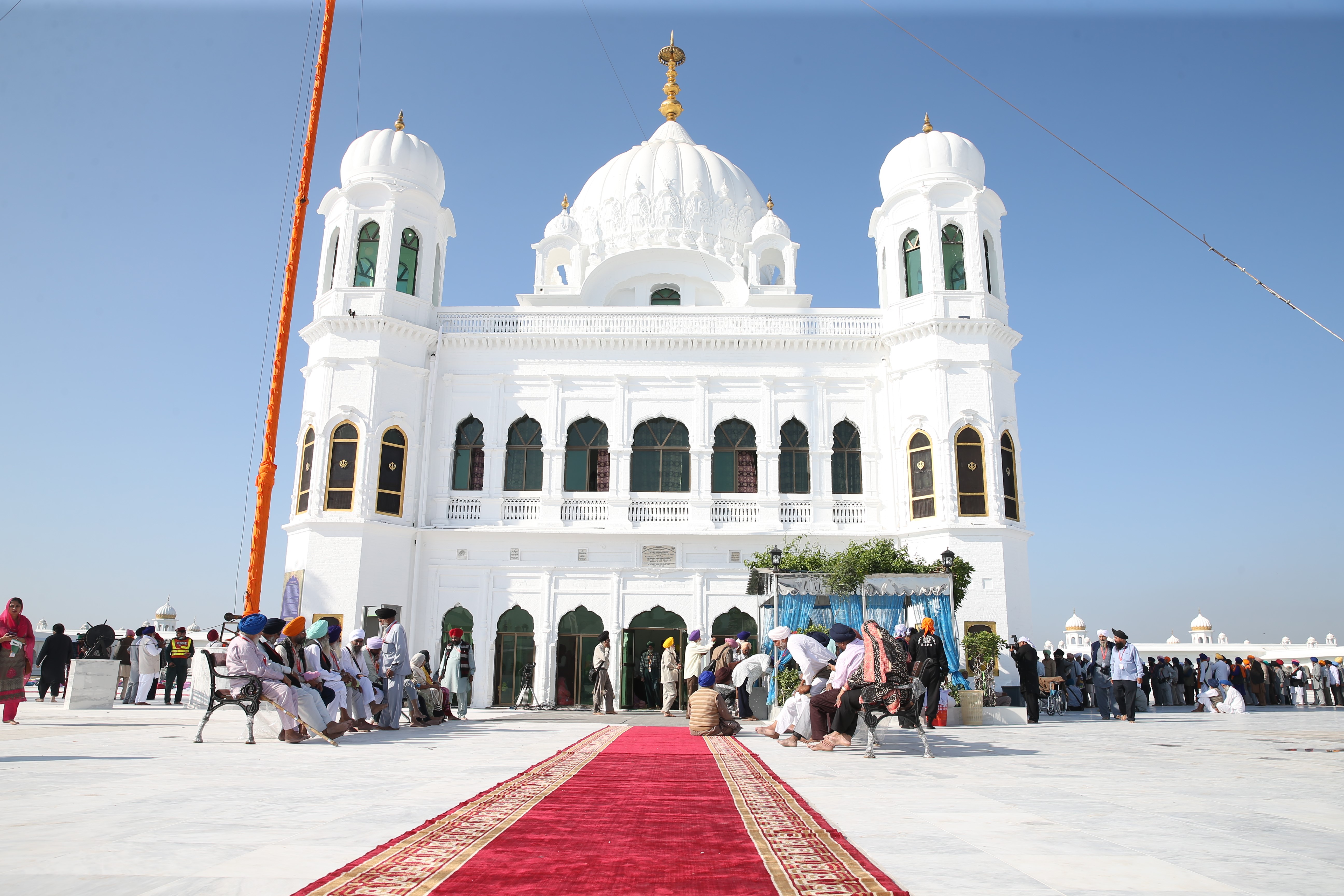 Sikh pilgrims pray at the Gurdwara Darbar Sahib Kartarpur during the inauguration ceremony of the Kartarpur corridor in Kartarpur, Pakistan, near the Indian border on November 9, 2019 [File: Muhammed Semih Uurlu/Anadolu via Getty Images]