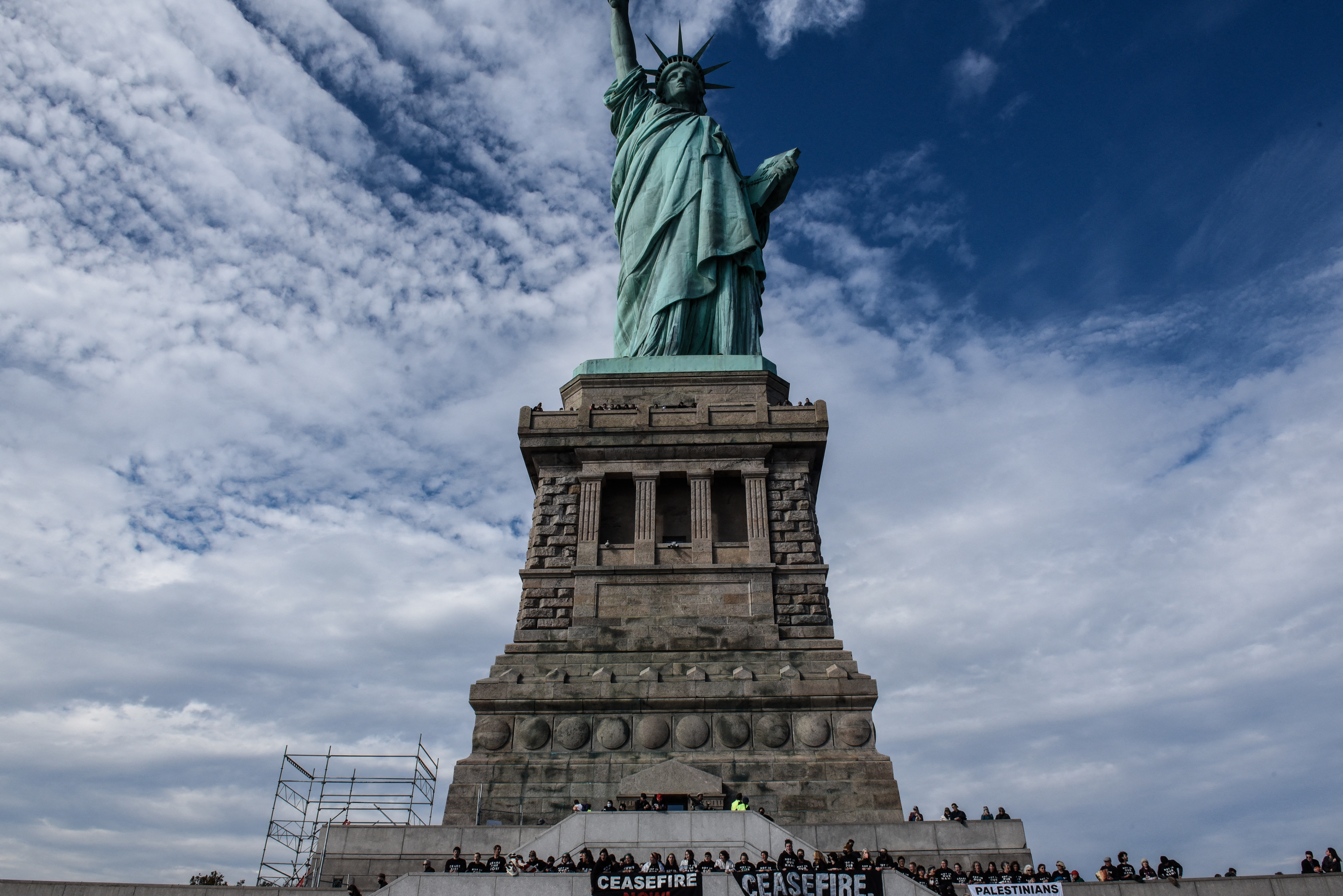Activists from Jewish Voice for Peace occupy the Statue of Liberty