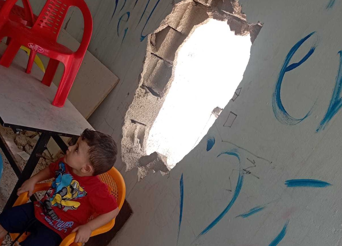 A hole is seen on the wall of the Children's Centre in the Jenin Refugee Camp after an Israeli raid in july