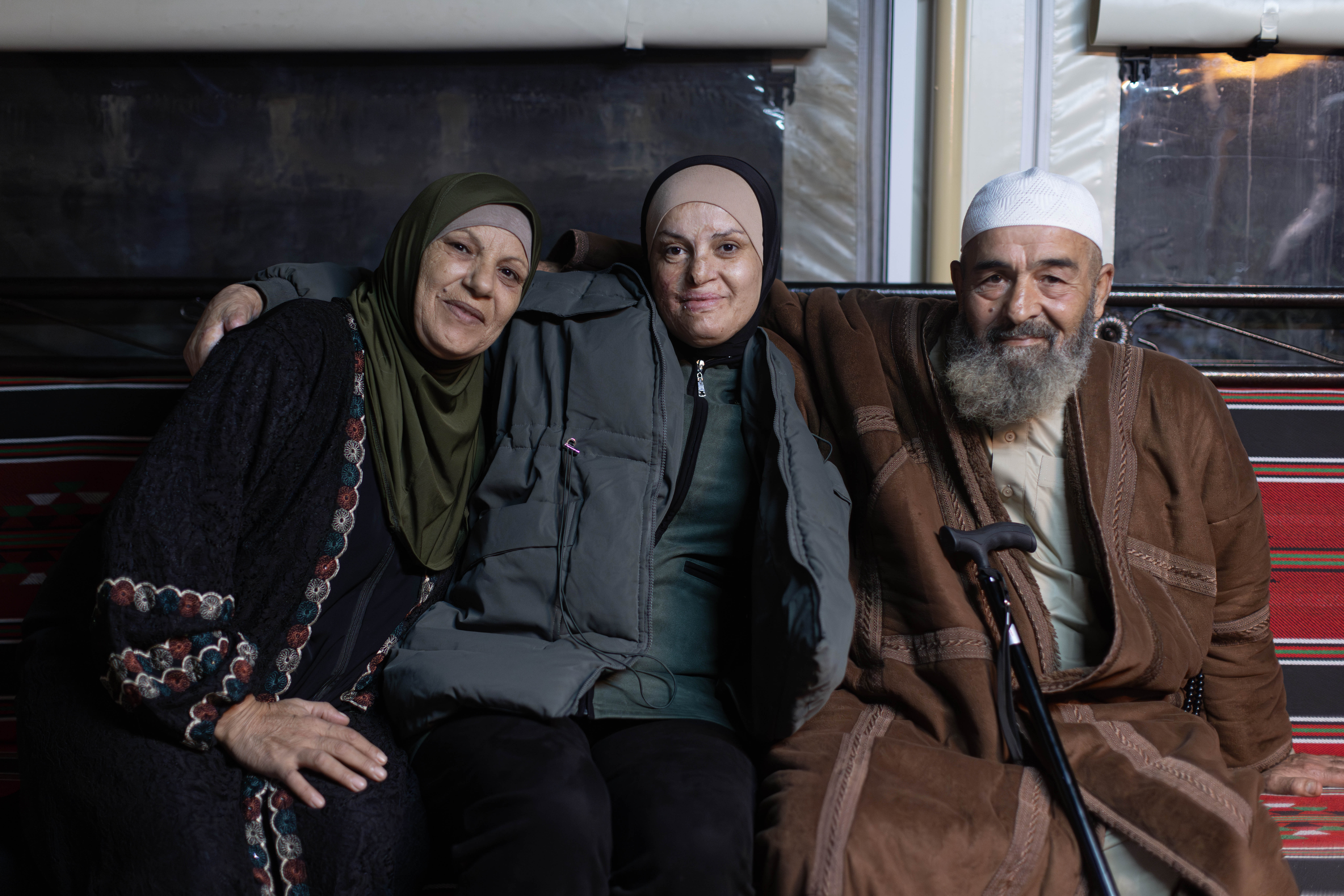 Israa Jaabis with her mother and father in the family house