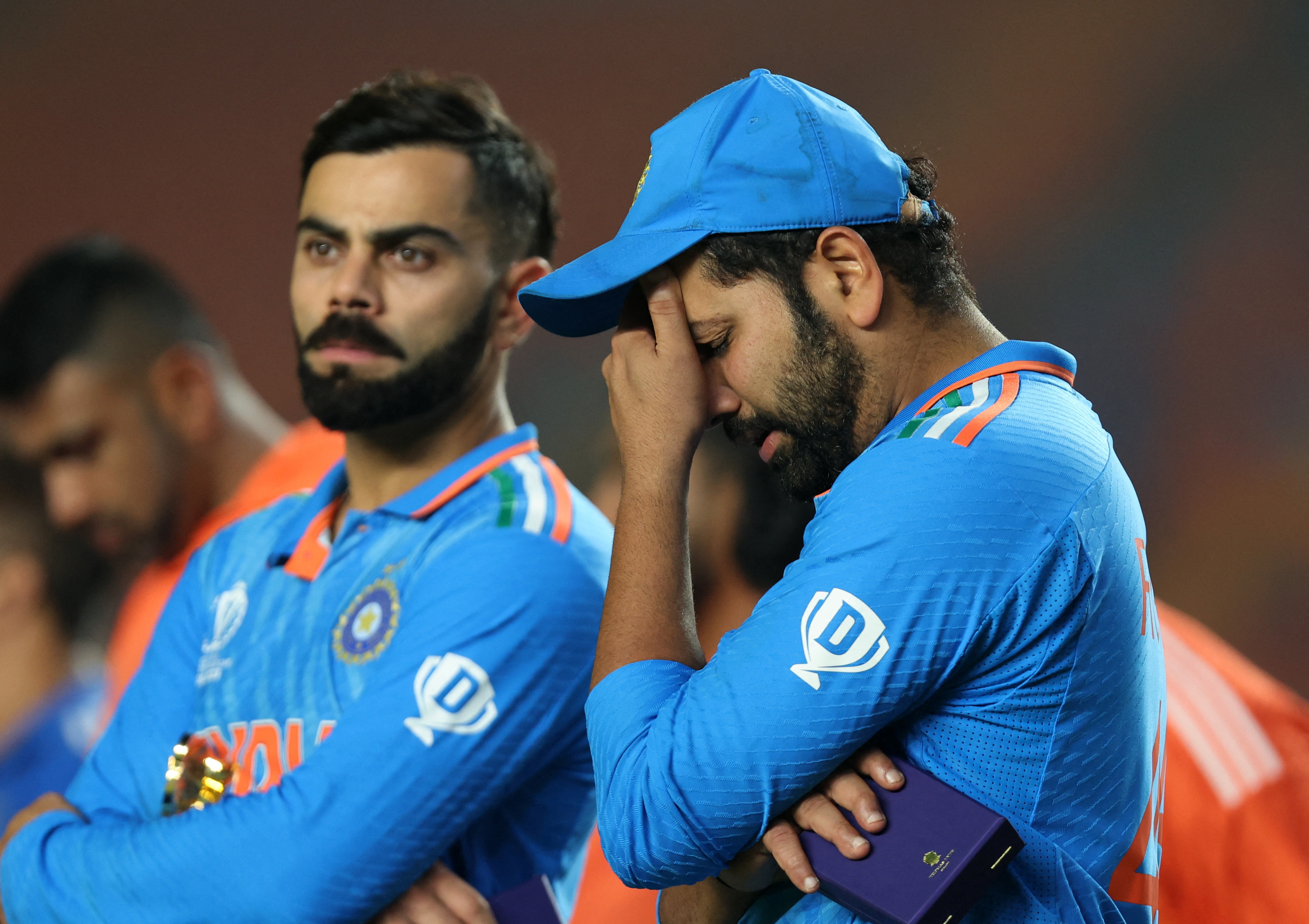 Cricket - ICC Cricket World Cup 2023 - Final - India v Australia - Narendra Modi Stadium, Ahmedabad, India - November 19, 2023 India's Virat Kohli and Rohit Sharma look dejected after losing the ICC Cricket World Cup final REUTERS/Amit Dave