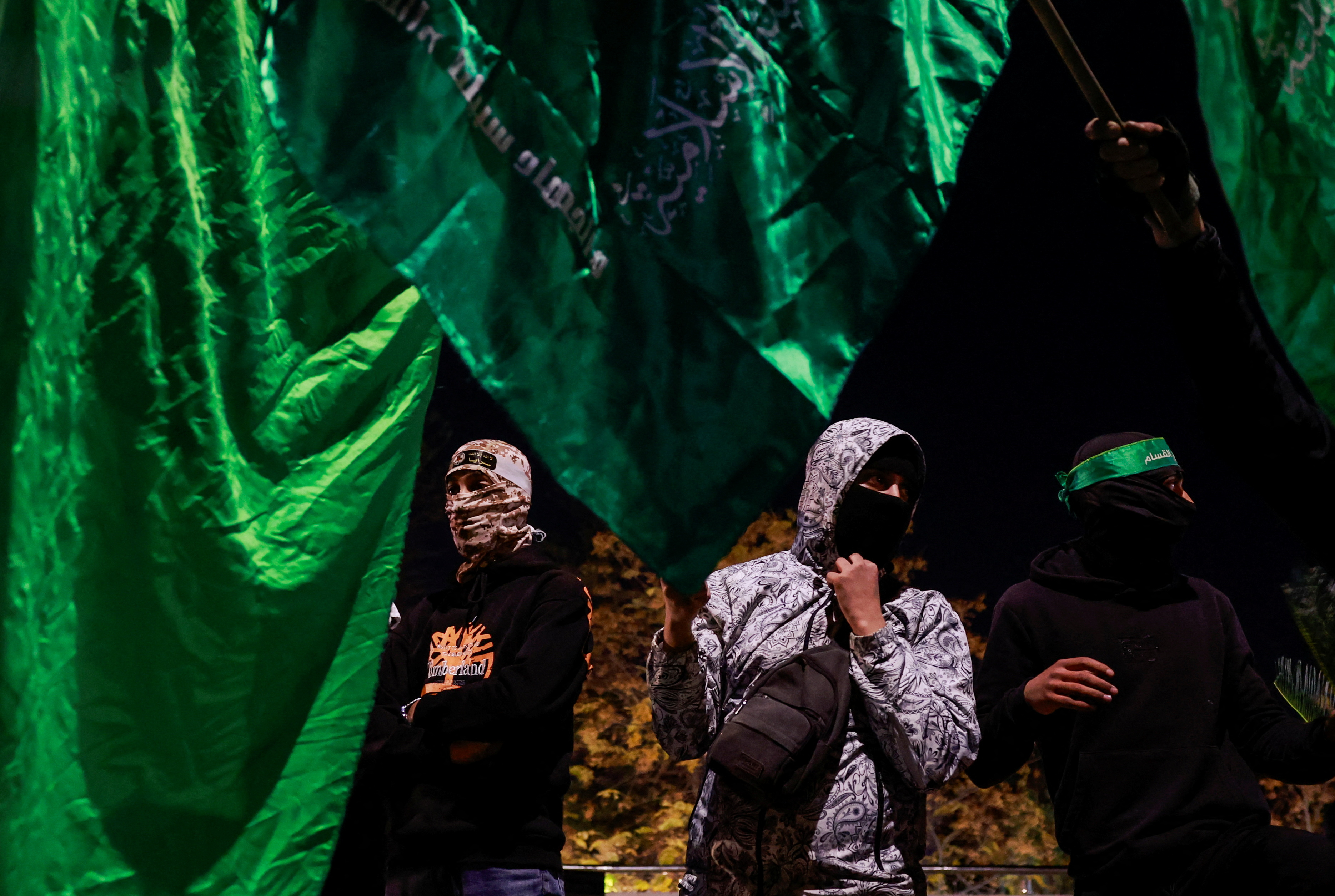 People react after Palestinian prisoners were released amid a hostages-prisoners swap deal between Hamas and Israel, in Ramallah.