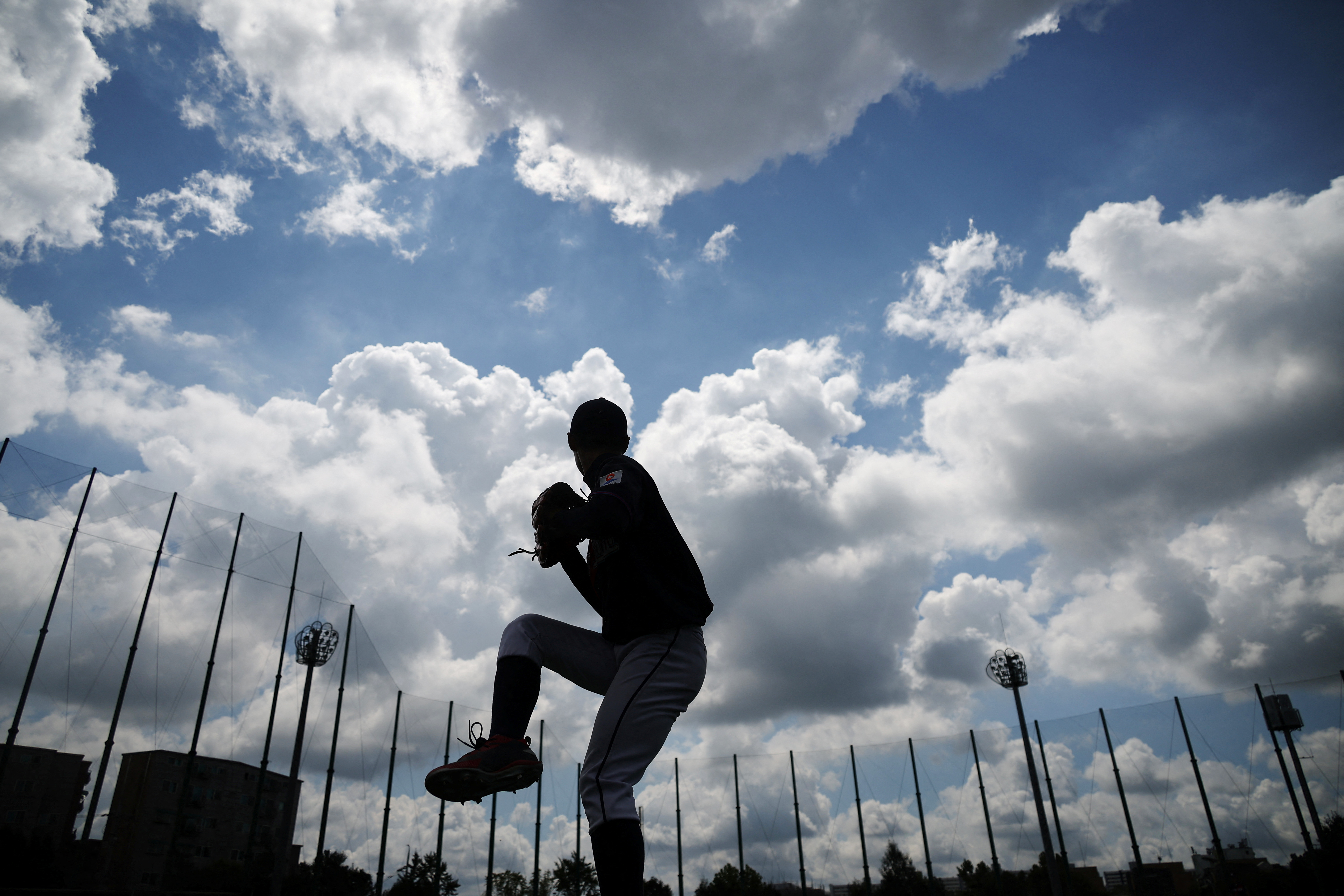 Choi Gwon-yul, a member of the Deokjeok High School baseball team, warms up before their second game of the 51st Bonghwang High School Baseball Tournament in Seoul, South Korea.