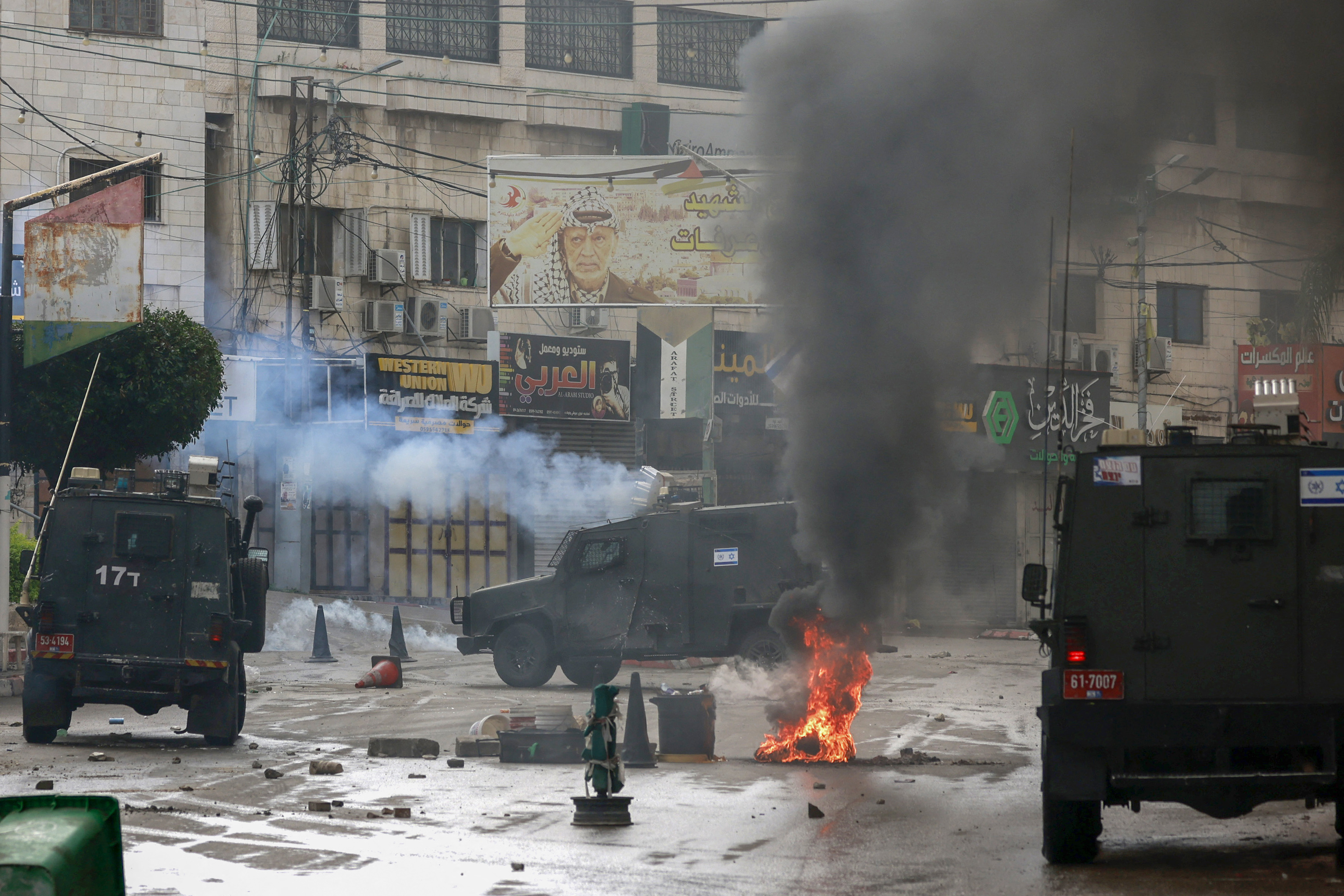 Tyres are set on fire to block Israeli army vehicles from advancing during a military operation in the occupied West Bank town of Tulkarem on November 14.