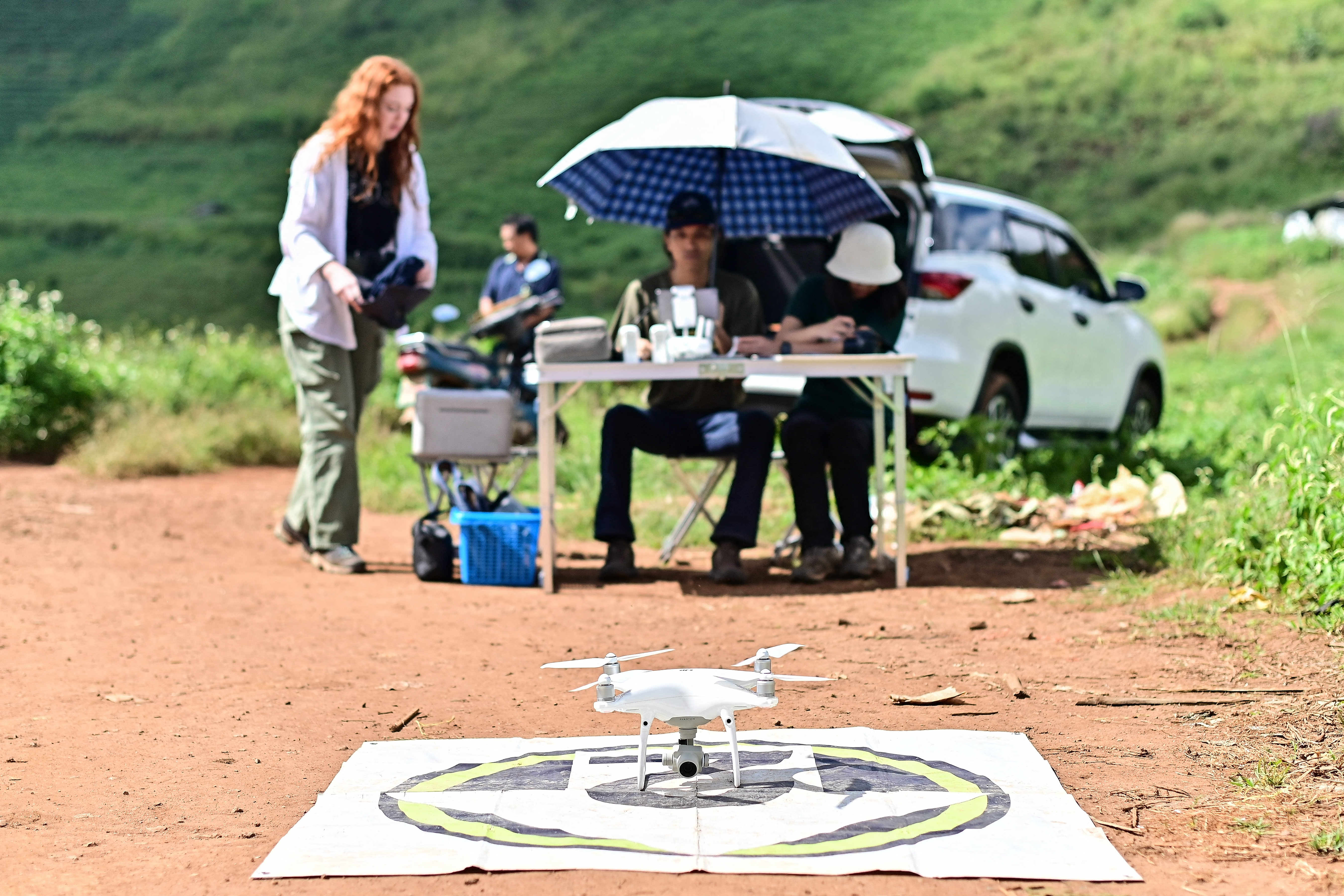 This picture taken on November 22, 2023 shows a drone to be used by Chiang Mai University's Forest Restoration Research Unit (FORRU) field research officer Worayut Takaew for a mapping survey of reforested land on a hillside near Chiang Mai.