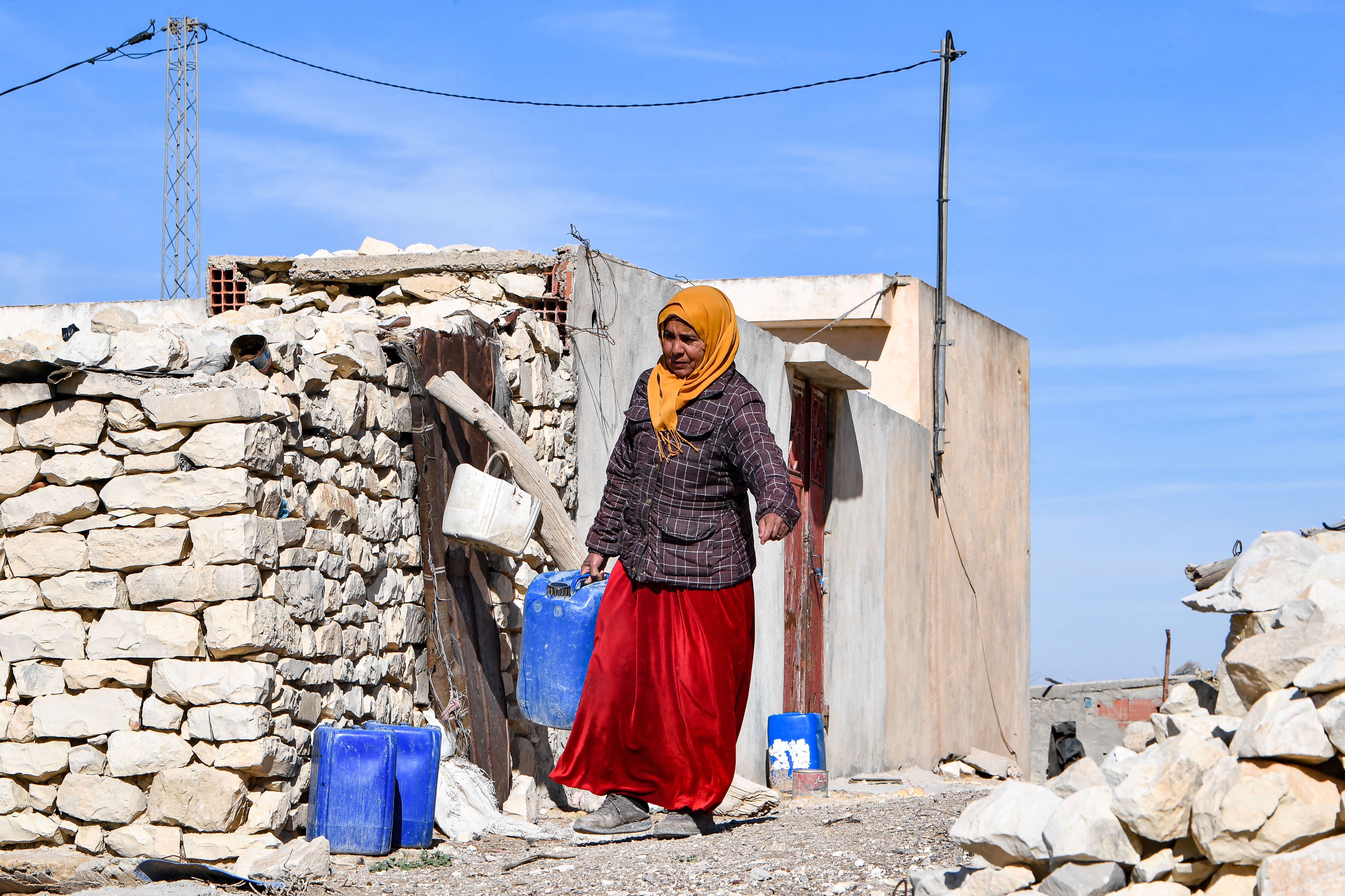 A Tunisian farmer brings water in a plastic jerry can in the remote Tunisian village of Ouled Omar, 180 kilometres southwest of the capital Tunis.